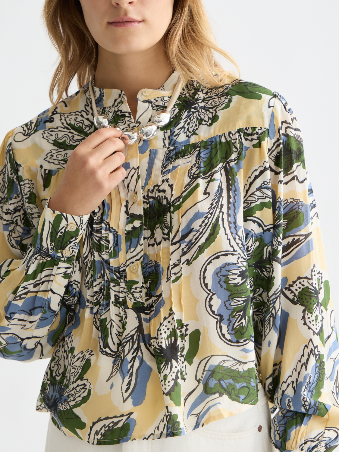 Long-sleeve Scotch & Soda pintuck shirt with button-up front and classic collar, displayed on a neutral background.