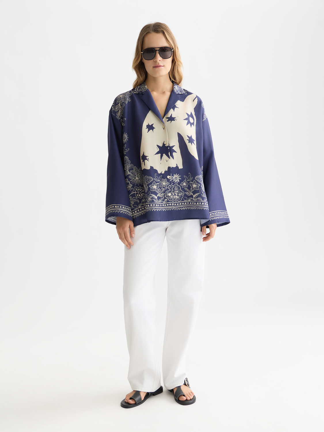 Long-sleeve printed shirt by Scotch & Soda, featuring vibrant patterns and casual fit, displayed on a hanger.