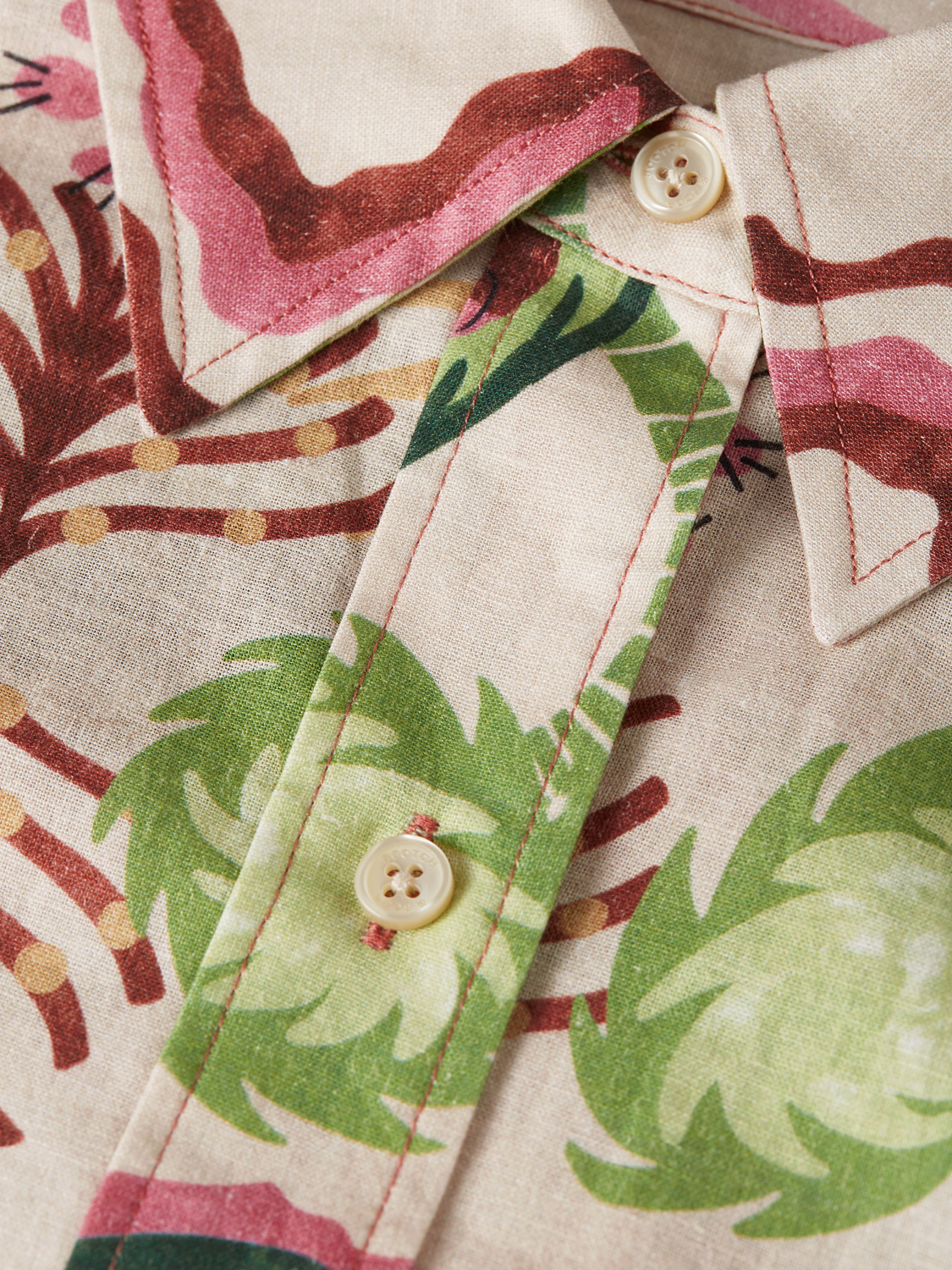 Long-sleeve printed shirt by Scotch & Soda featuring vibrant patterns and casual fit, displayed on a mannequin.