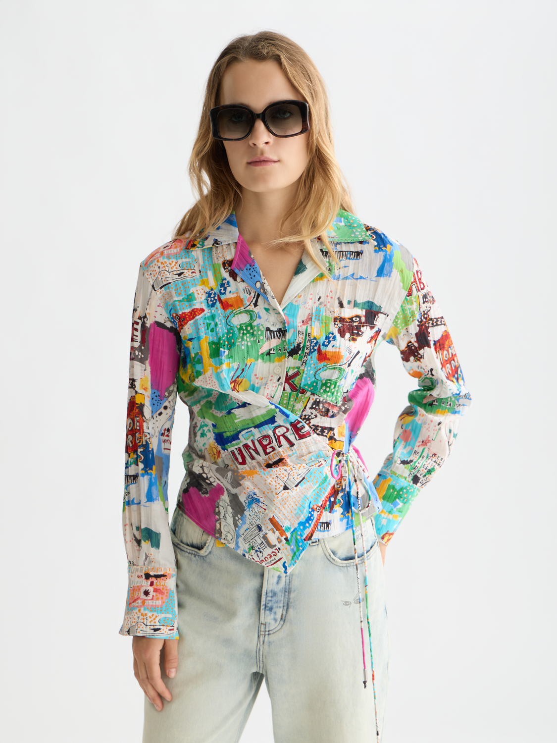 Long-sleeved S&S x Basquiat shirt by Scotch & Soda, featuring vibrant graphic artwork on the front.
