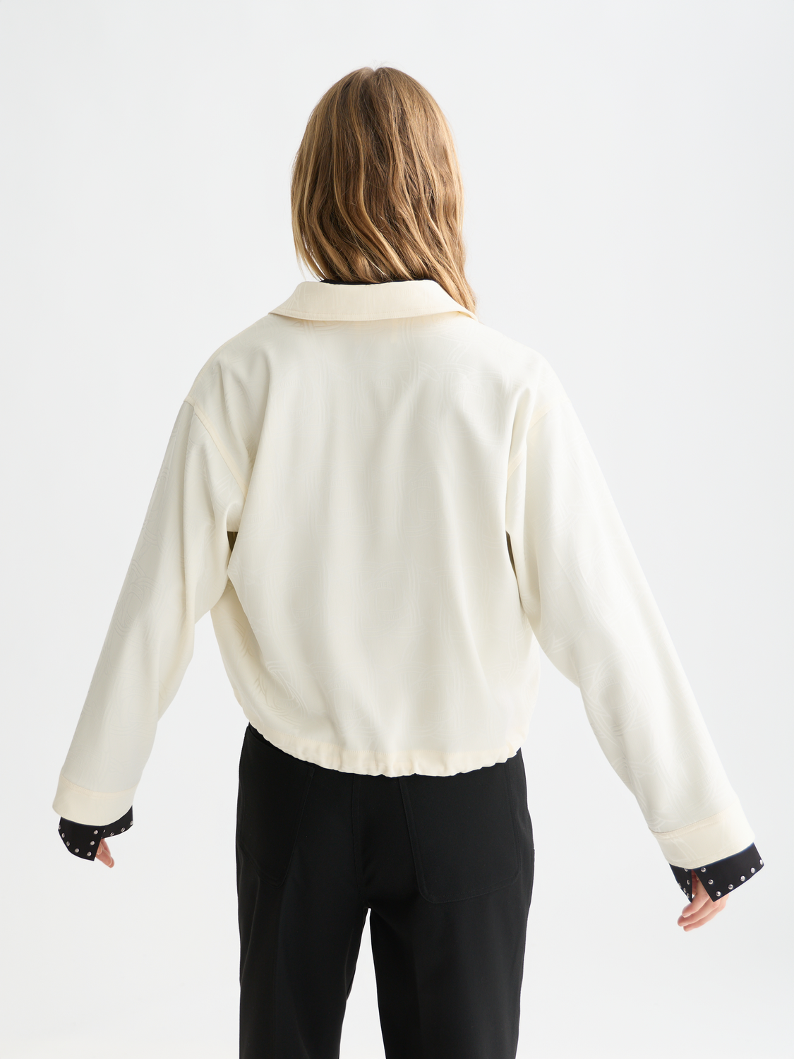 Long-sleeve Scotch & Soda utility shirt displayed on a model, featuring functional pockets and casual style.