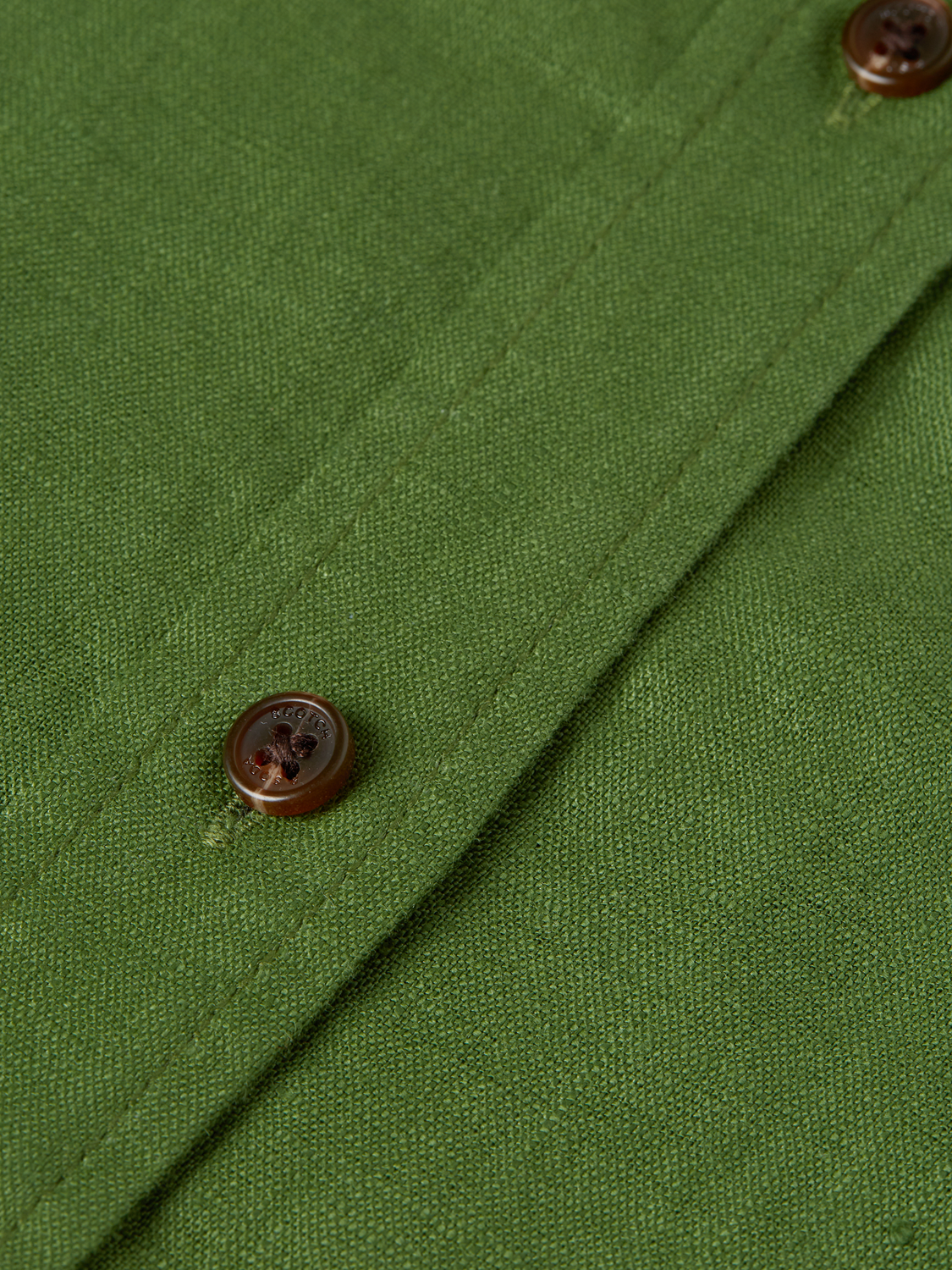 Men's long-sleeve linen shirt by Scotch & Soda, light and breathable fabric, displayed on a hanger.
