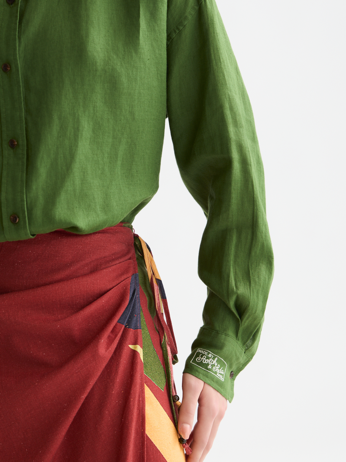 Long-sleeve linen shirt by Scotch & Soda, shown on a model with a relaxed fit and natural fabric texture.