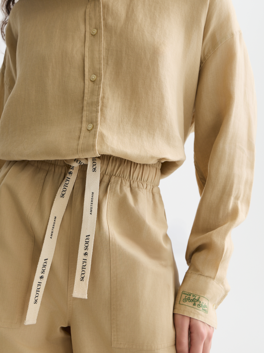Long-sleeve linen shirt by Scotch & Soda, featuring a relaxed fit and natural fabric texture, displayed on a model.