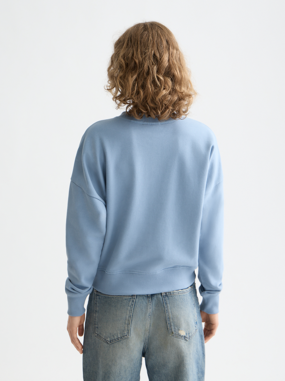 Black sweatshirt with chest artwork from SCOTCH & SODA, featuring a relaxed fit and casual style.