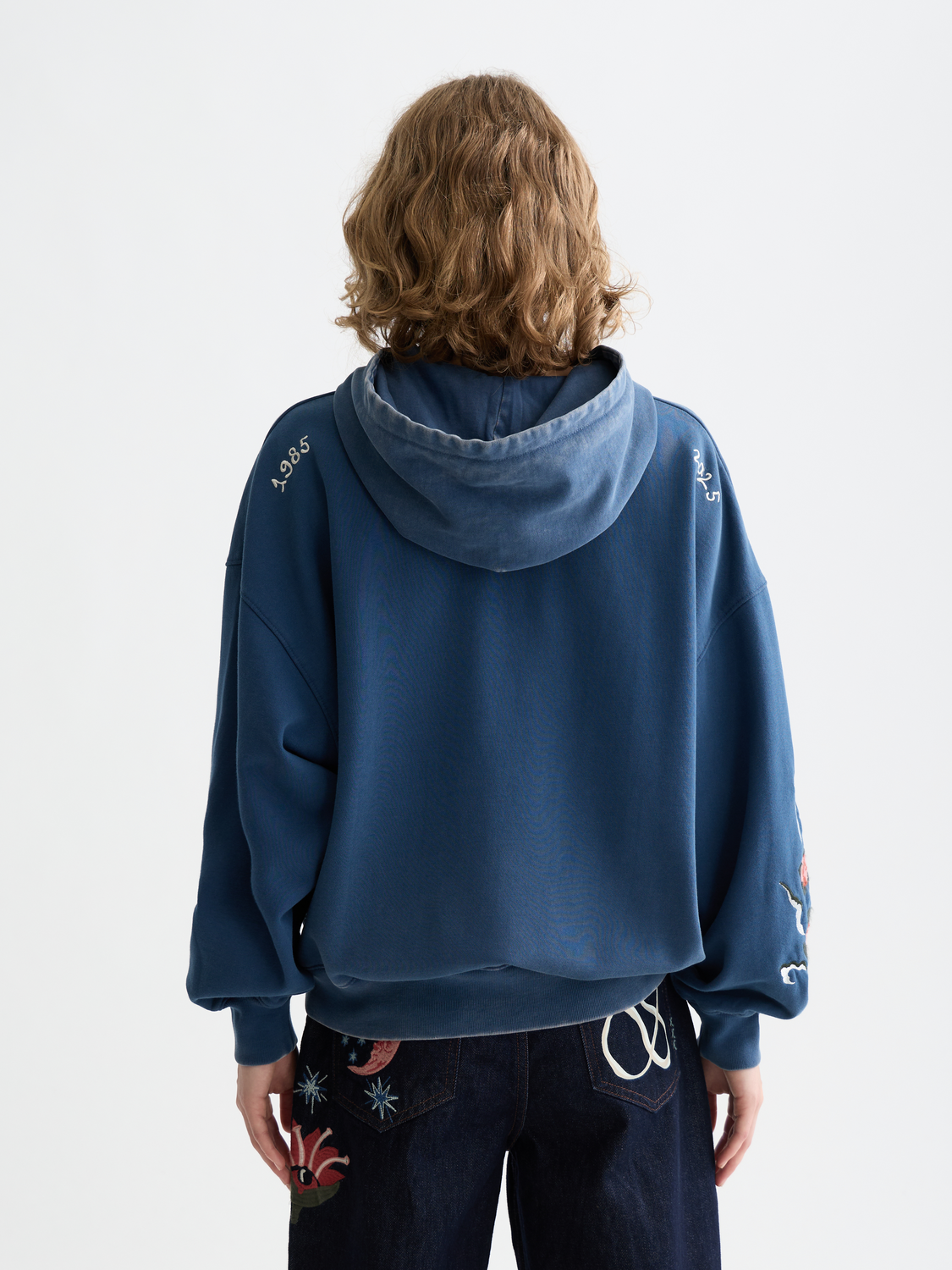 Washed artwork hoodie by Scotch & Soda, featuring a relaxed fit and artistic print on soft sweatshirt fabric, back view.