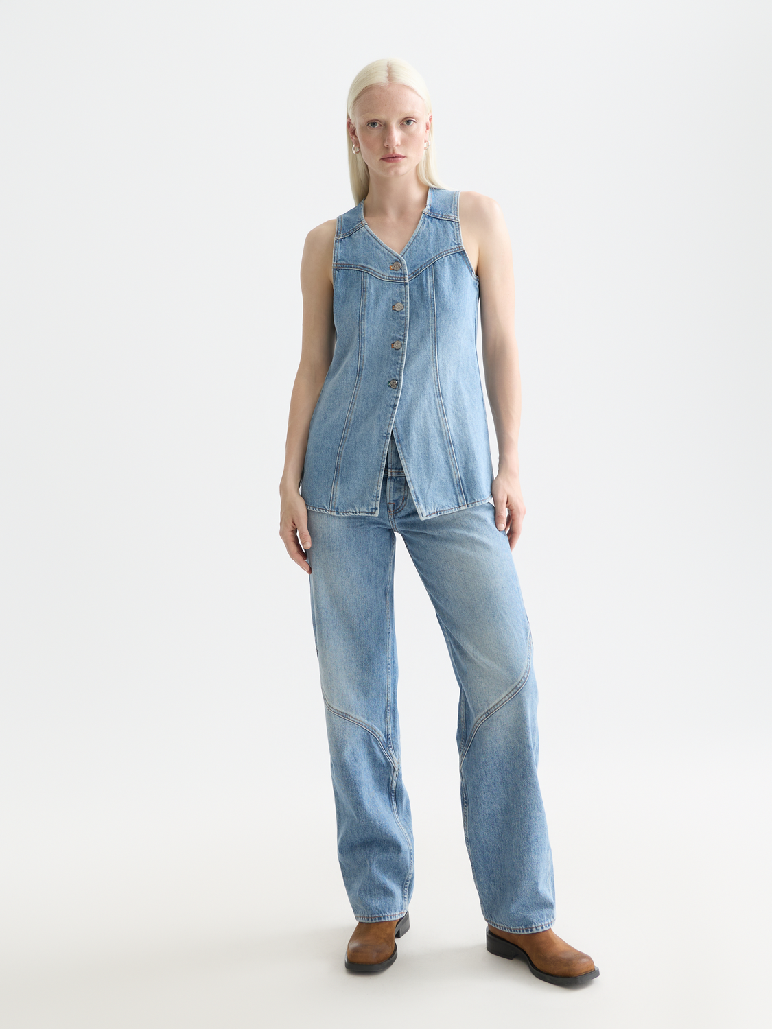 Western denim gilet by Scotch & Soda featuring button closures and sleeveless design, styled on a model.