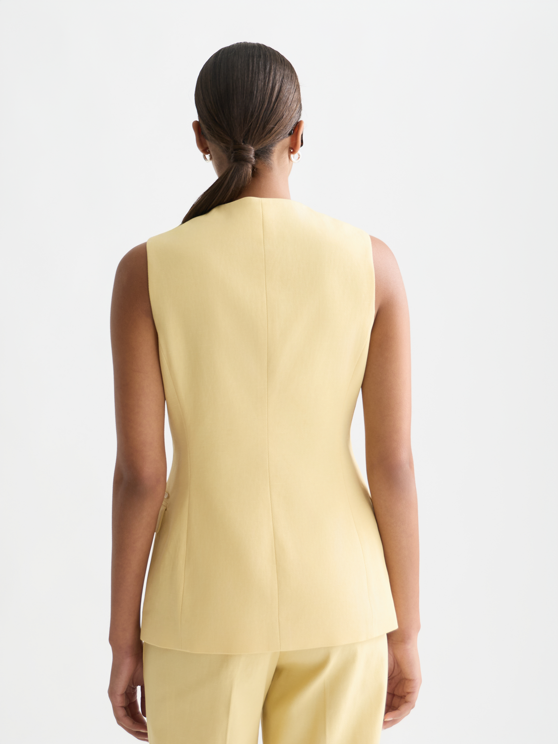Tailored Scotch & Soda gilet in dark fabric, shown from the back, featuring a fitted design and stylish stitching details.