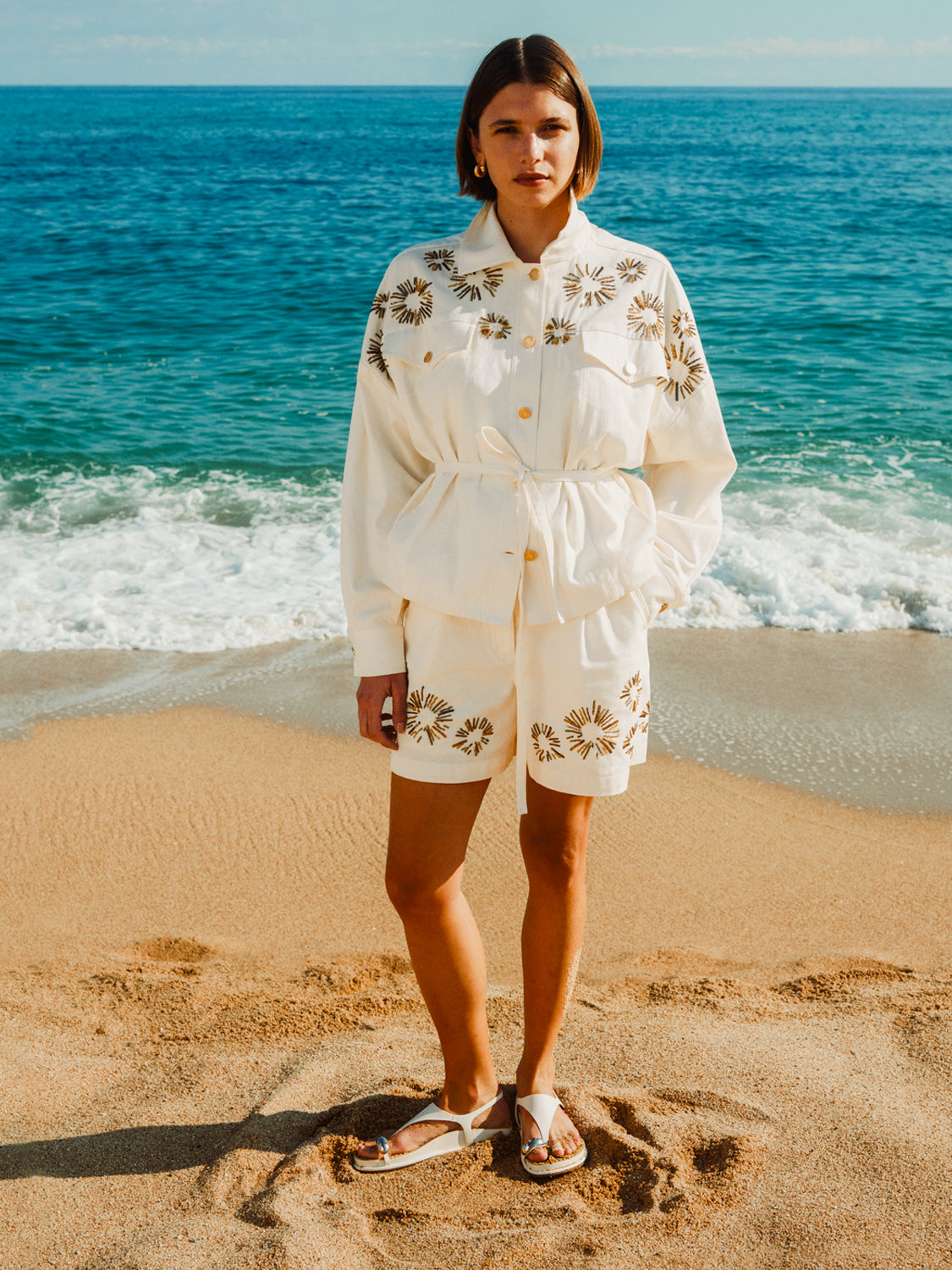 Embroidered shorts by Scotch & Soda featuring intricate floral embroidery and a relaxed fit, shown on a model.