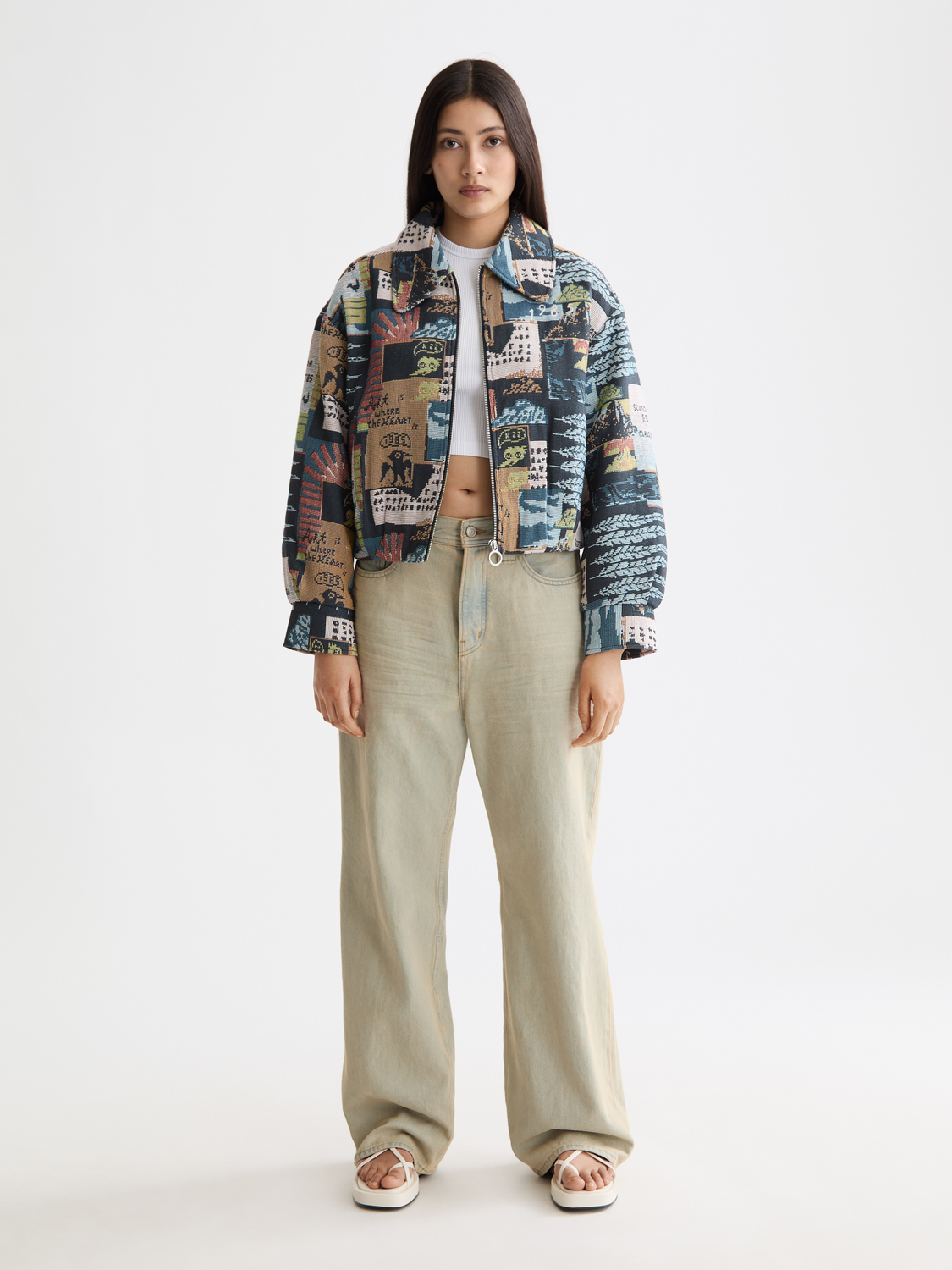 Scotch & Soda jacquard jacket featuring intricate woven pattern, tailored fit, and stylish design on a model.