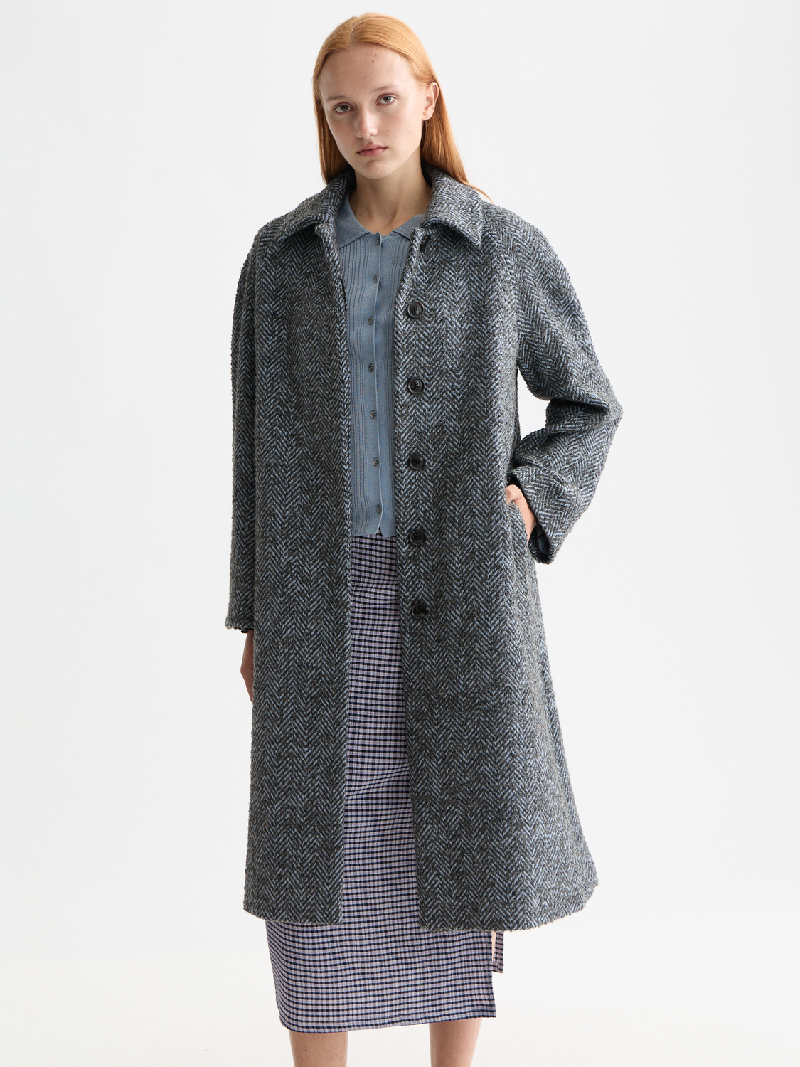 Wool-blend carcoat jacket from Scotch & Soda featuring classic design and neutral color, displayed on a hanger.