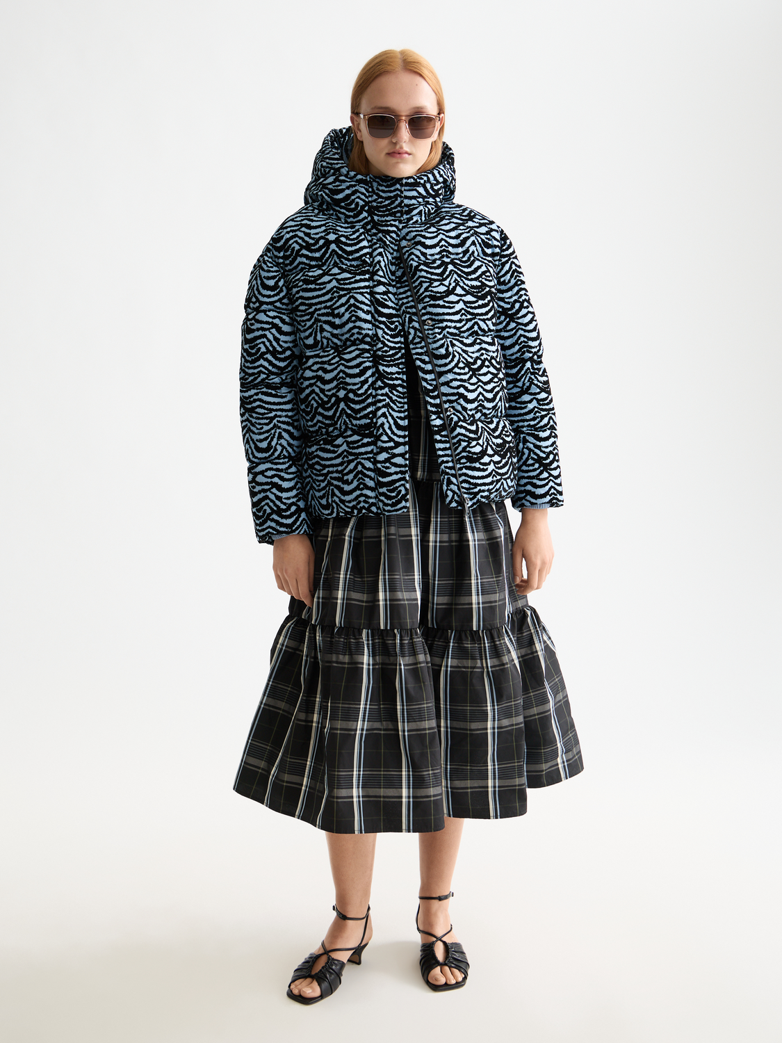 Scotch & Soda hooded puffer jacket with front zipper, quilted design, and adjustable hood, suitable for cold weather.