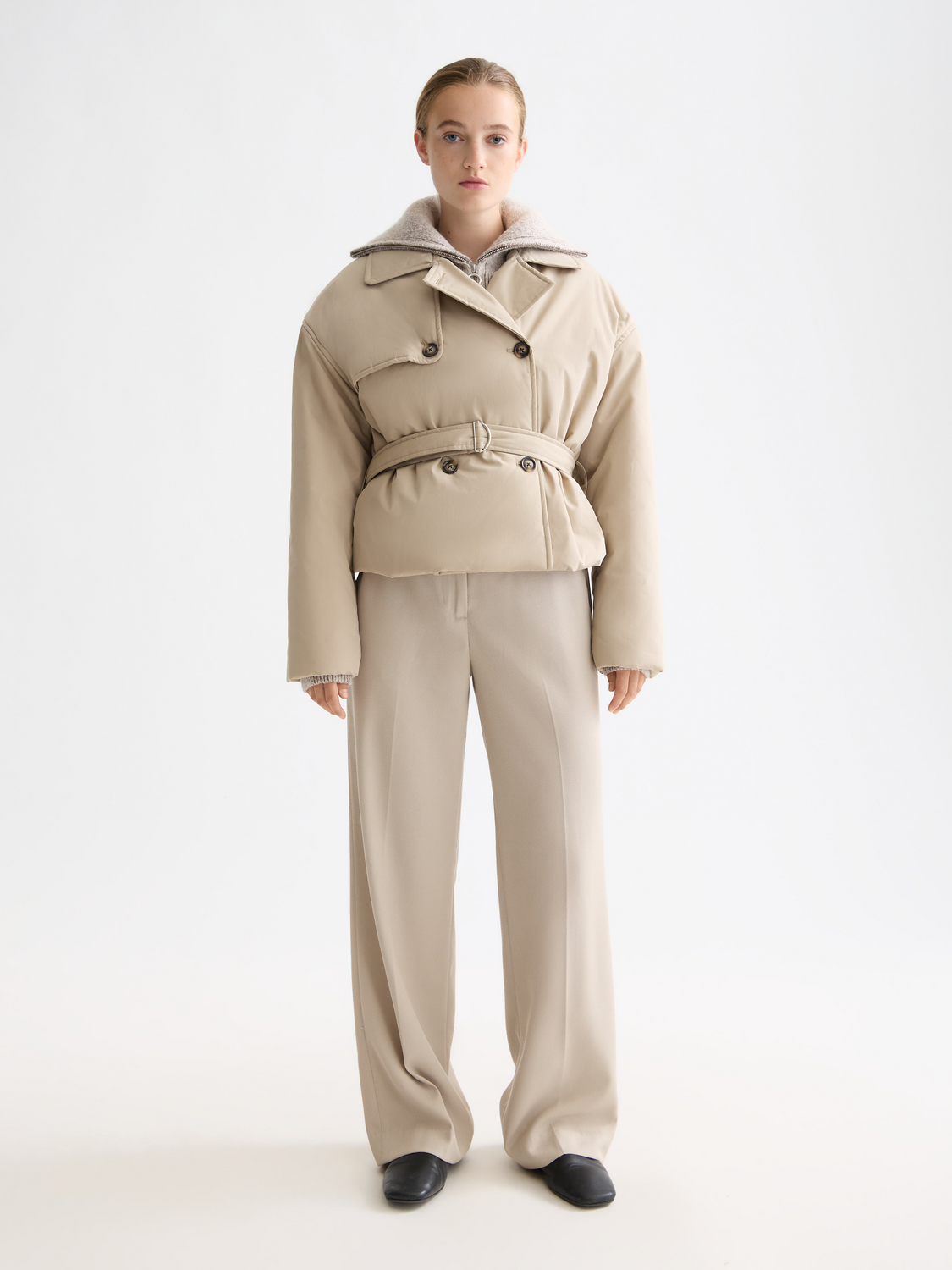 Padded cropped trench coat by Scotch & Soda, stylish jacket with a fitted silhouette and button details, shown on a model.