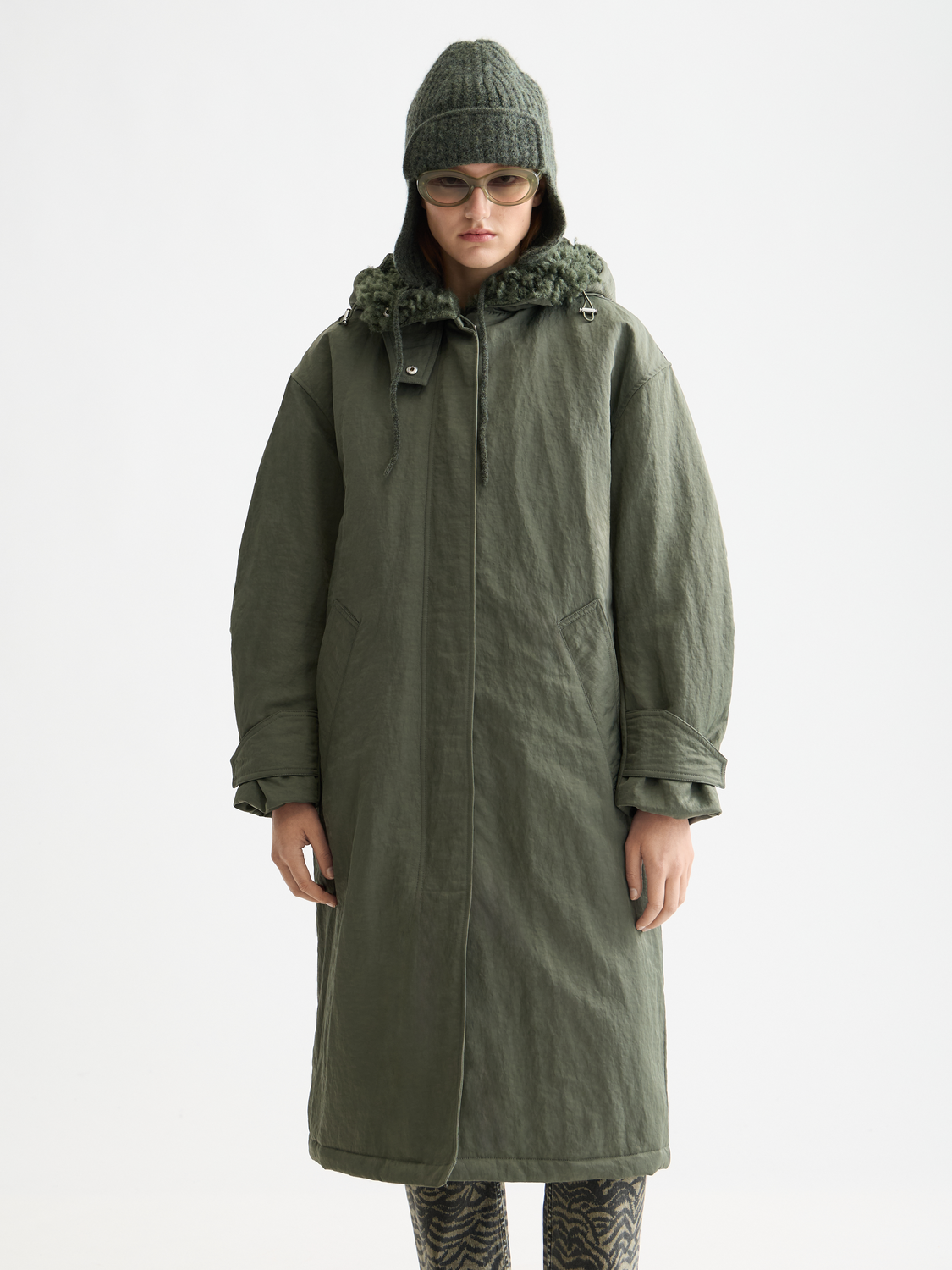 Light gray 2-in-1 Scotch & Soda parka jacket with hood and zippered front, shown on a model.