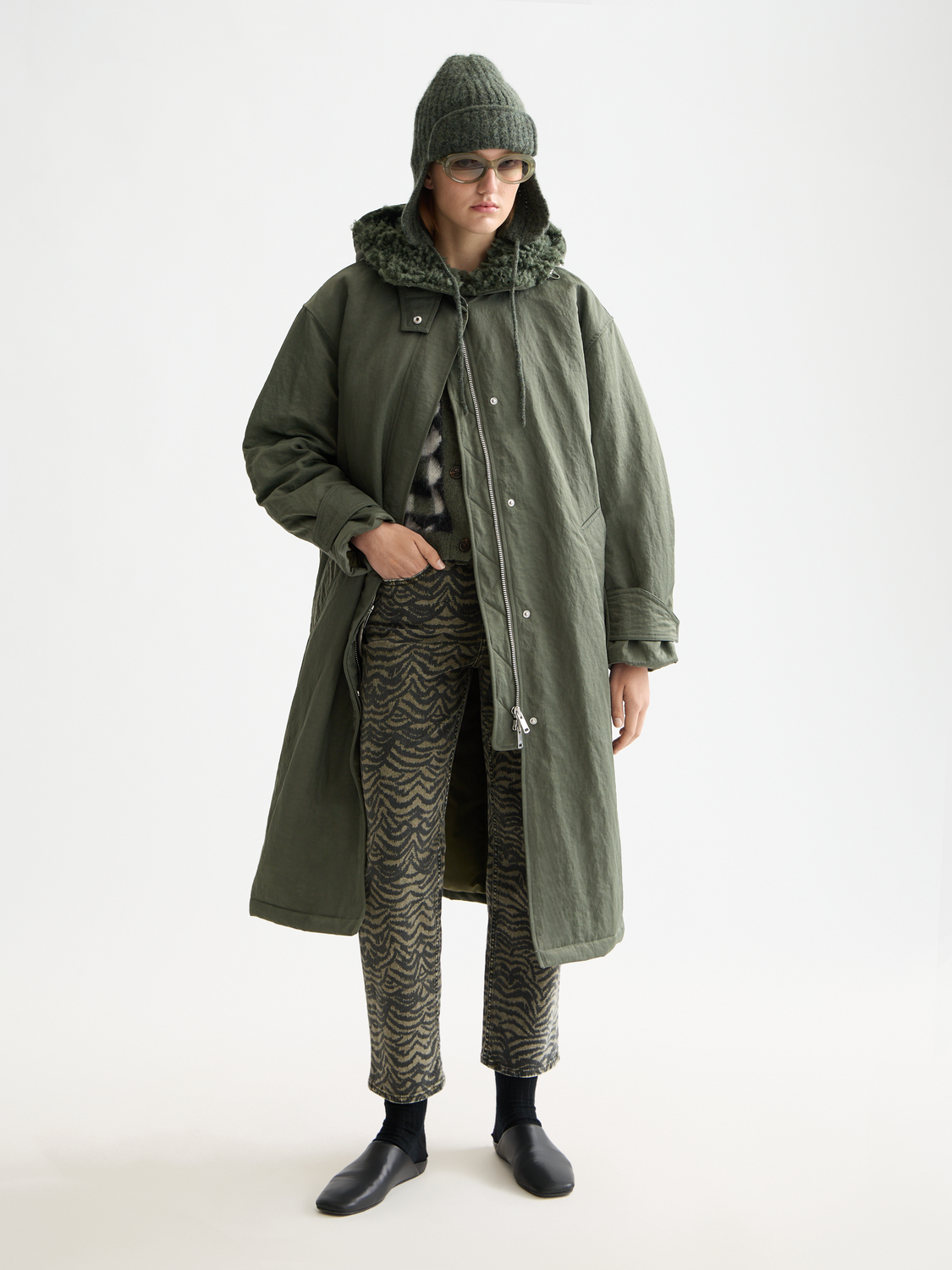 Black 2-in-1 Scotch & Soda parka jacket with hood, featuring a sleek design and functional pockets.