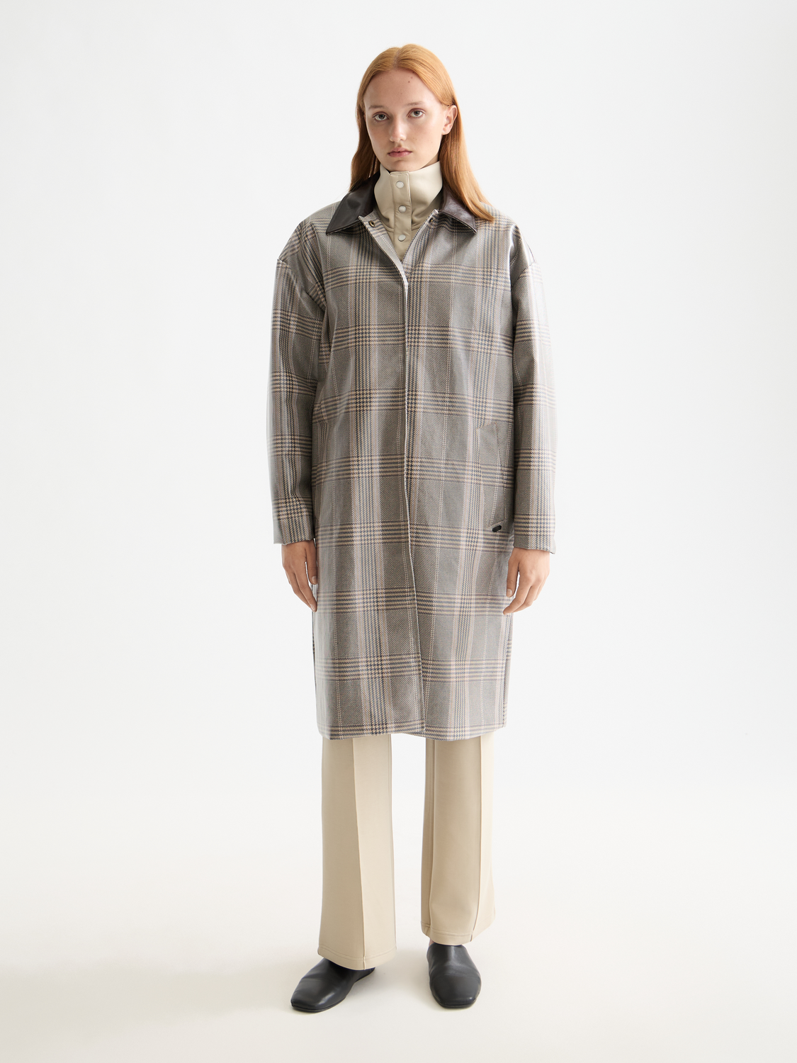 Yellow coated raincoat from Scotch & Soda jacket with a hood, waterproof fabric, and button closures.