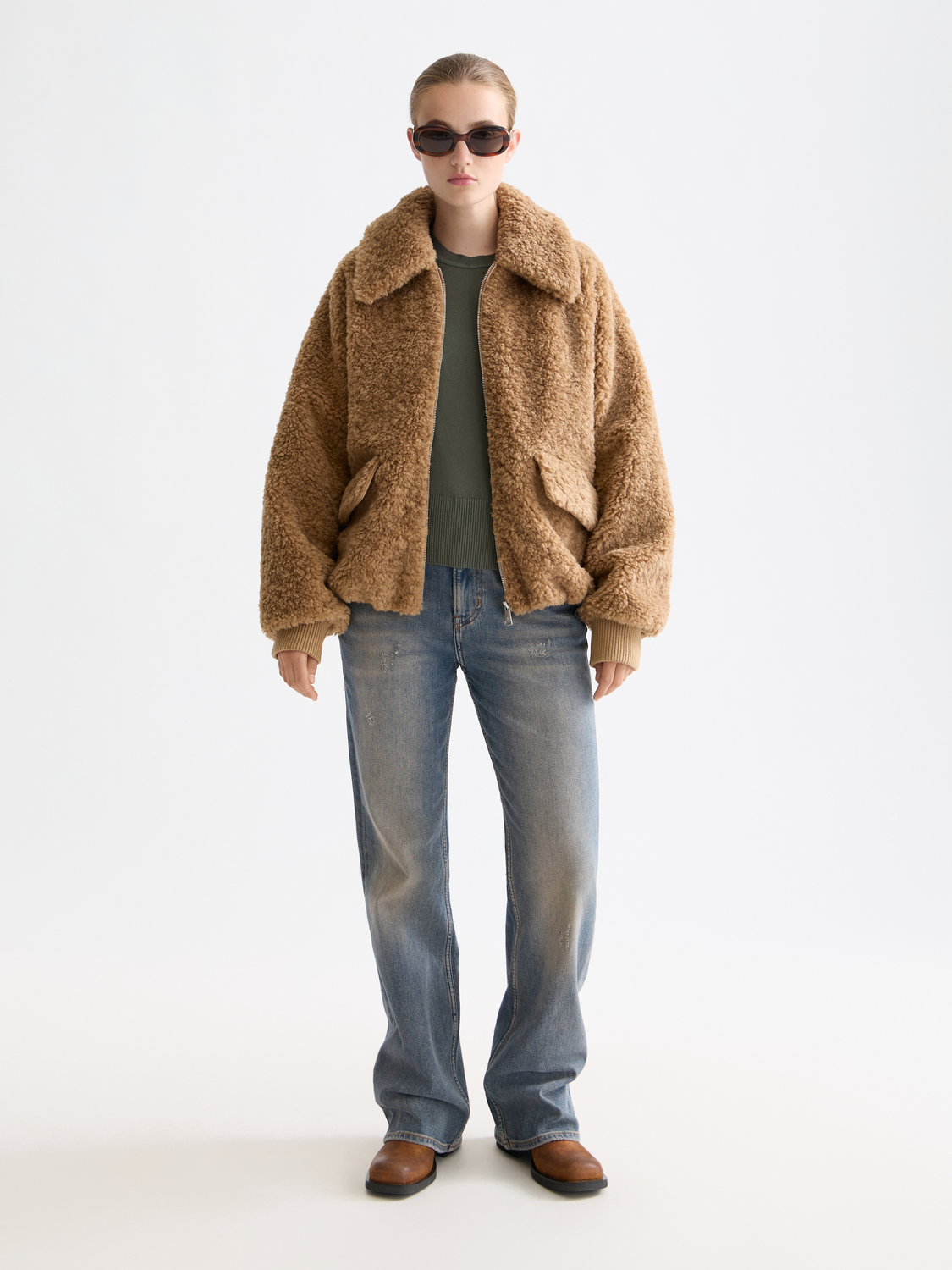 Scotch & Soda teddy bomber jacket featuring a plush, textured exterior with a front zipper and ribbed collar.