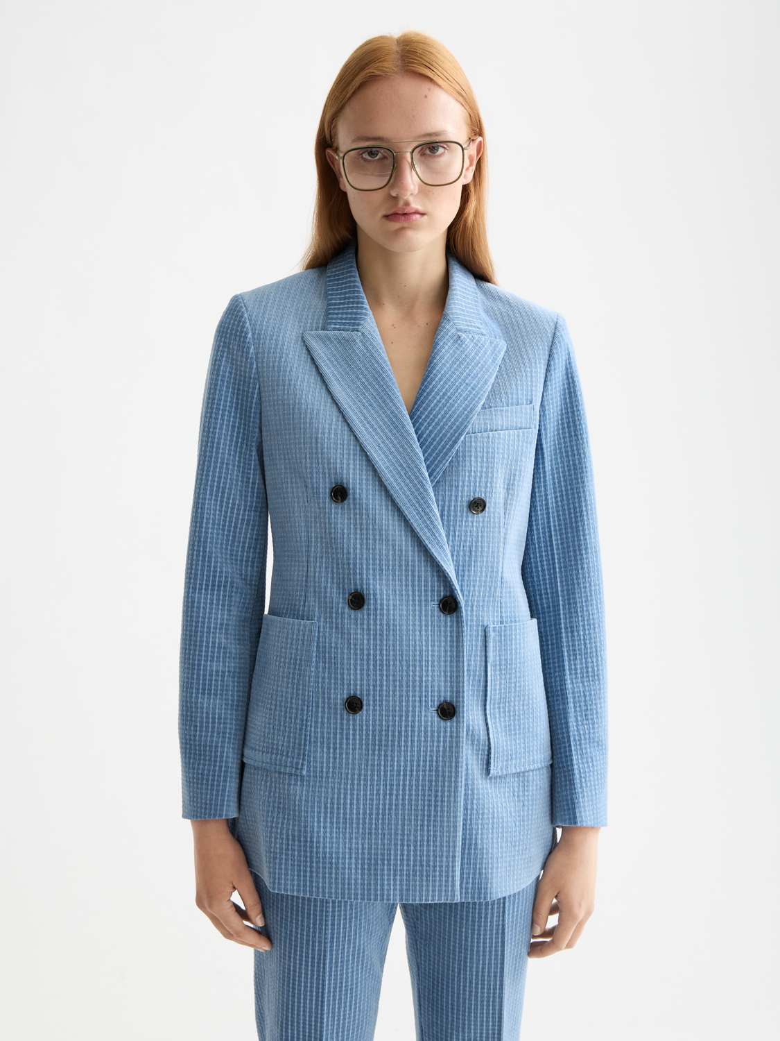 Scotch & Soda corduroy blazer in dark green, tailored fit with notched lapels and front button closure, displayed on a model.