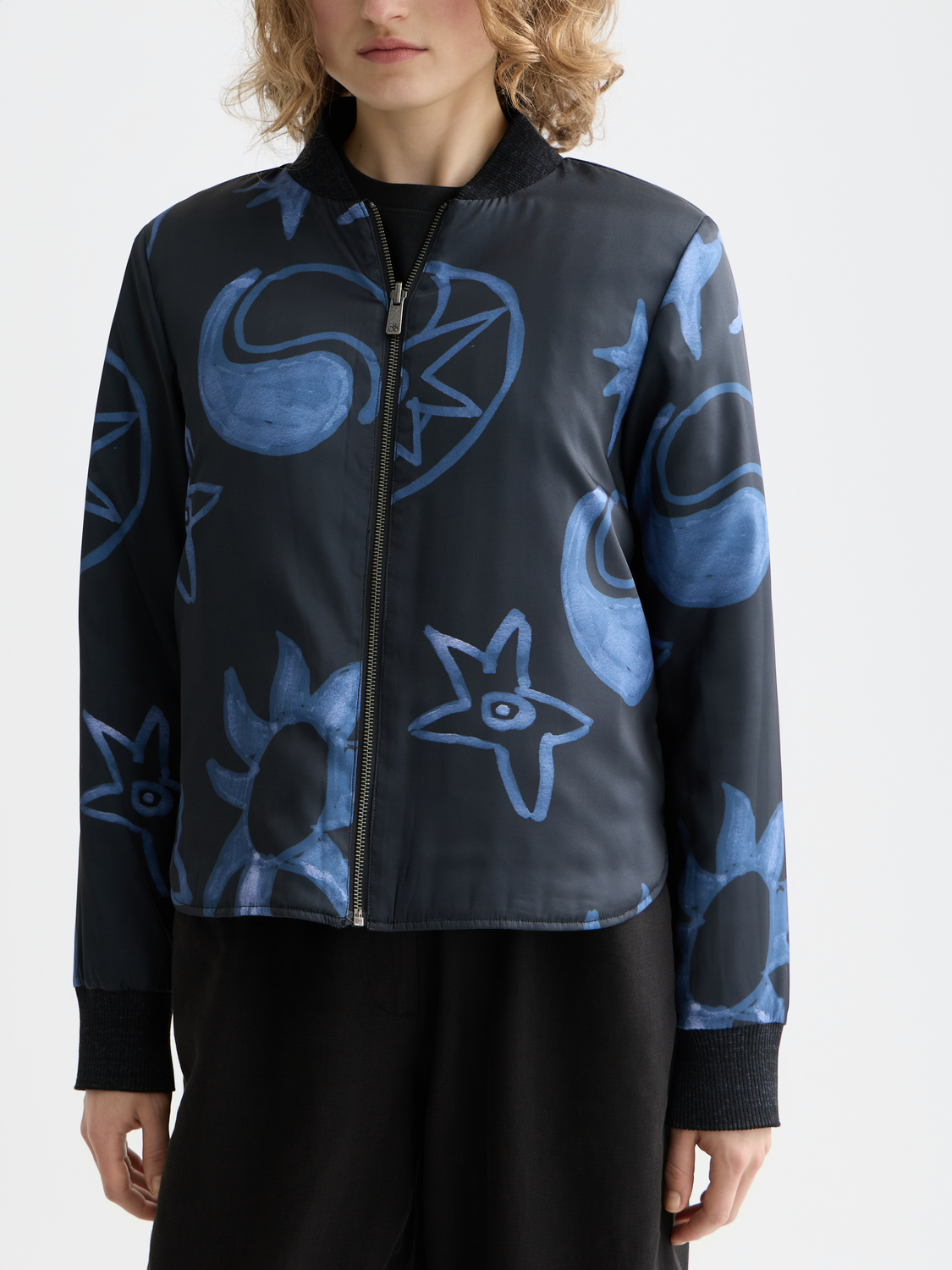 Reversible quilted bomber jacket by SCOTCH & SODA with quilted design, showing both solid and patterned sides.