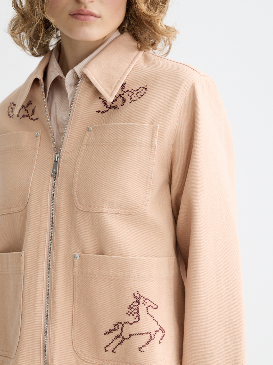 Embroidered Scotch & Soda jacket with detailed floral embroidery, stylish design, and classic jacket silhouette.