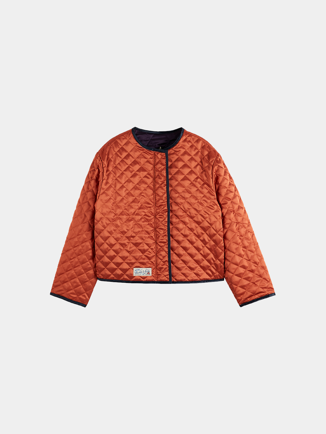 Reversible souvenir jacket by Scotch & Soda featuring bold patterns and vibrant colors, shown with one side displayed.