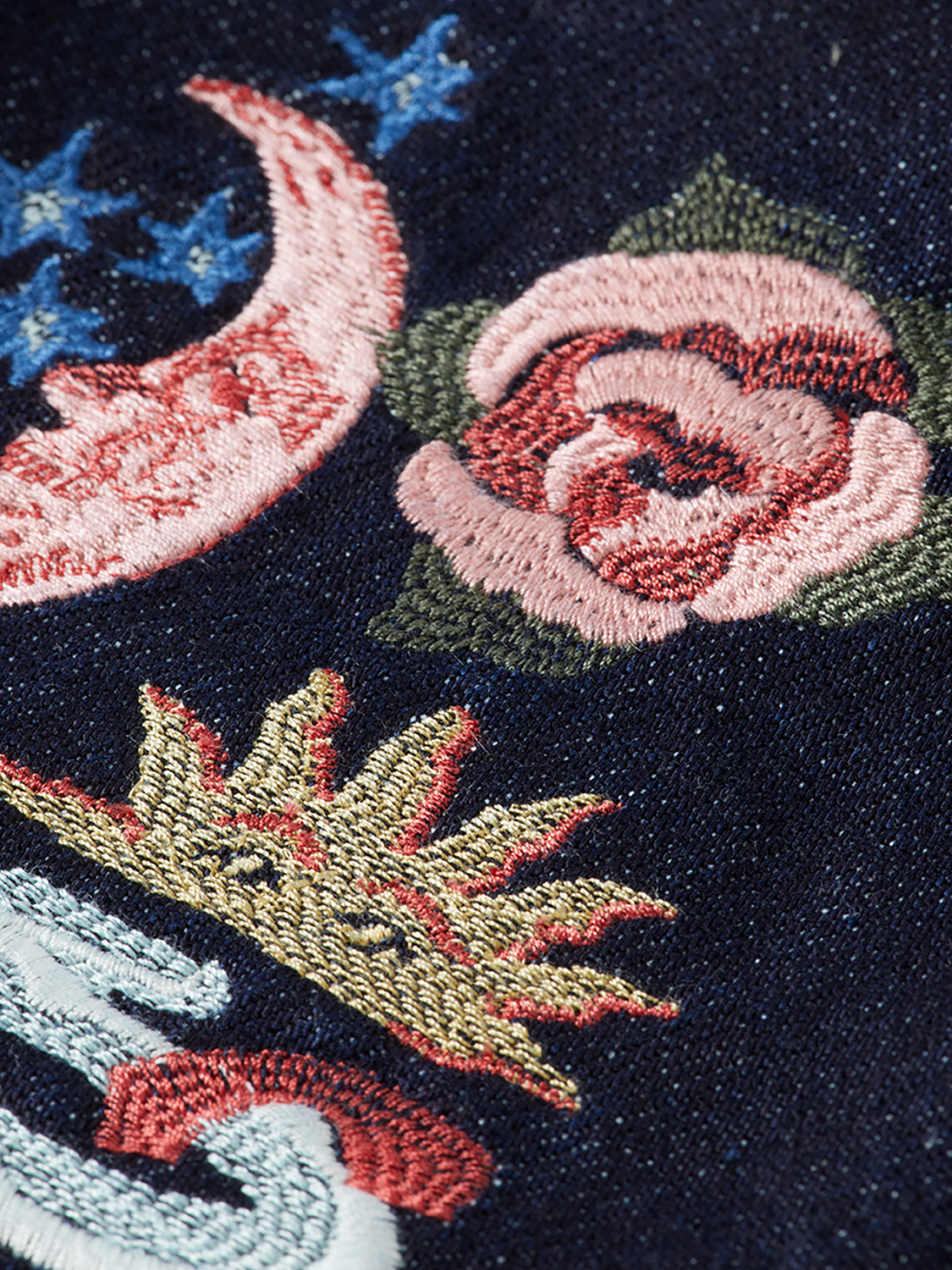 Embroidered denim jacket by Scotch & Soda featuring intricate embroidery, classic fit, and stylish details on the front and sleeves.