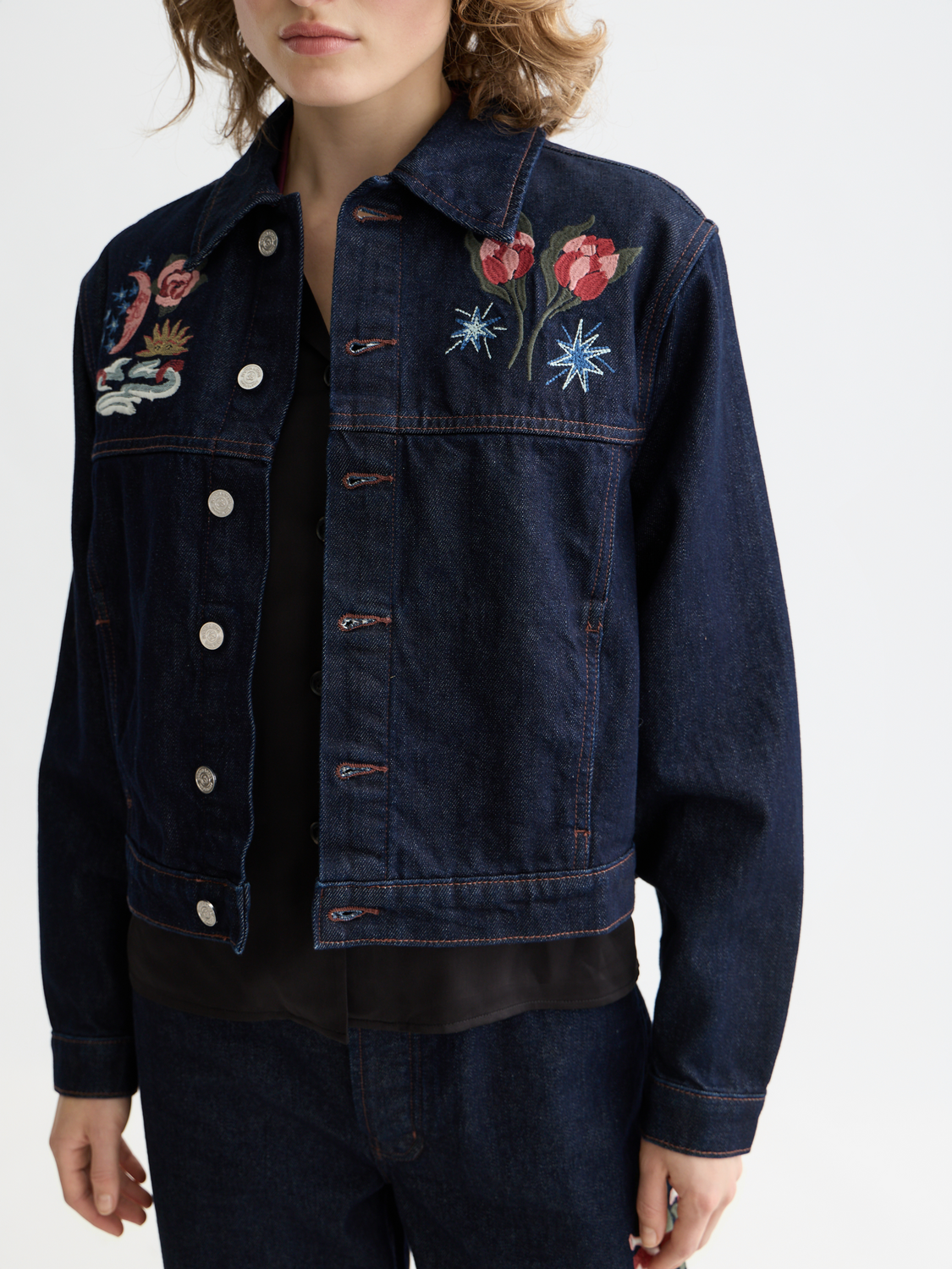 Embroidered denim jacket by Scotch & Soda featuring detailed embroidery, classic fit, and stylish design.