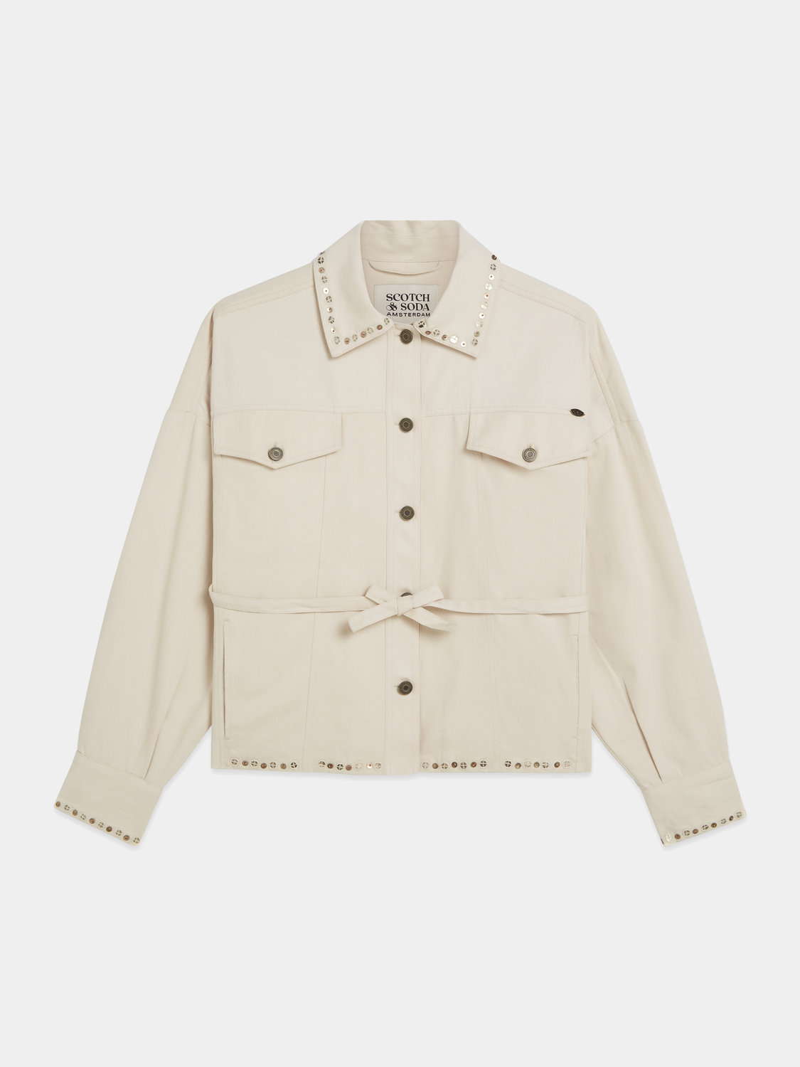 Embellished SCOTCH & SODA trucker jacket with decorative details and classic denim style, shown on a hanger.