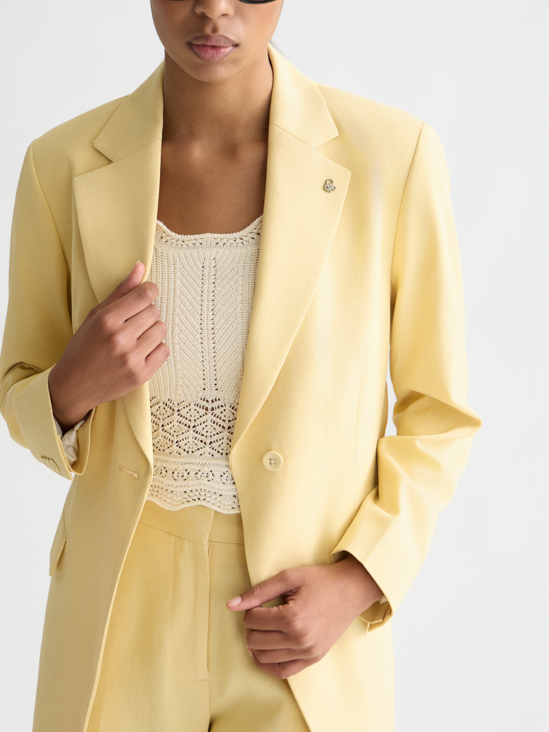 Navy single-breasted blazer by Scotch & Soda displayed on a model, featuring structured lapels and a tailored fit.