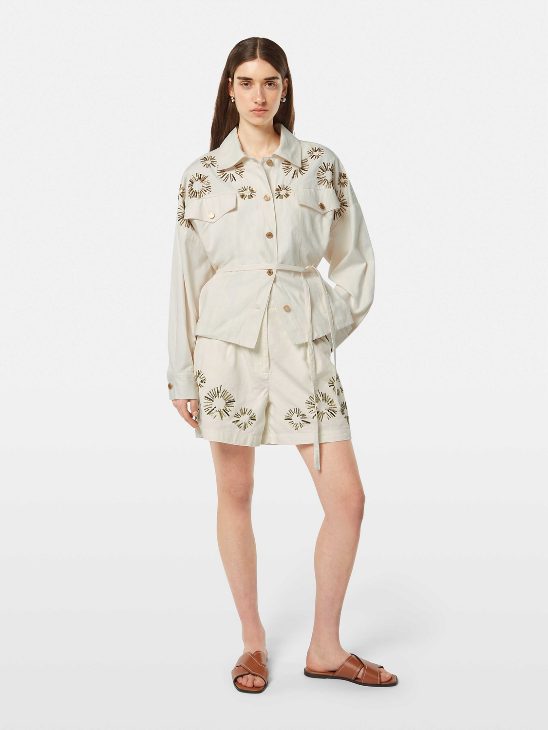 Embroidered shorts by Scotch & Soda featuring colorful floral embroidery on light fabric, casual summer fashion for women.