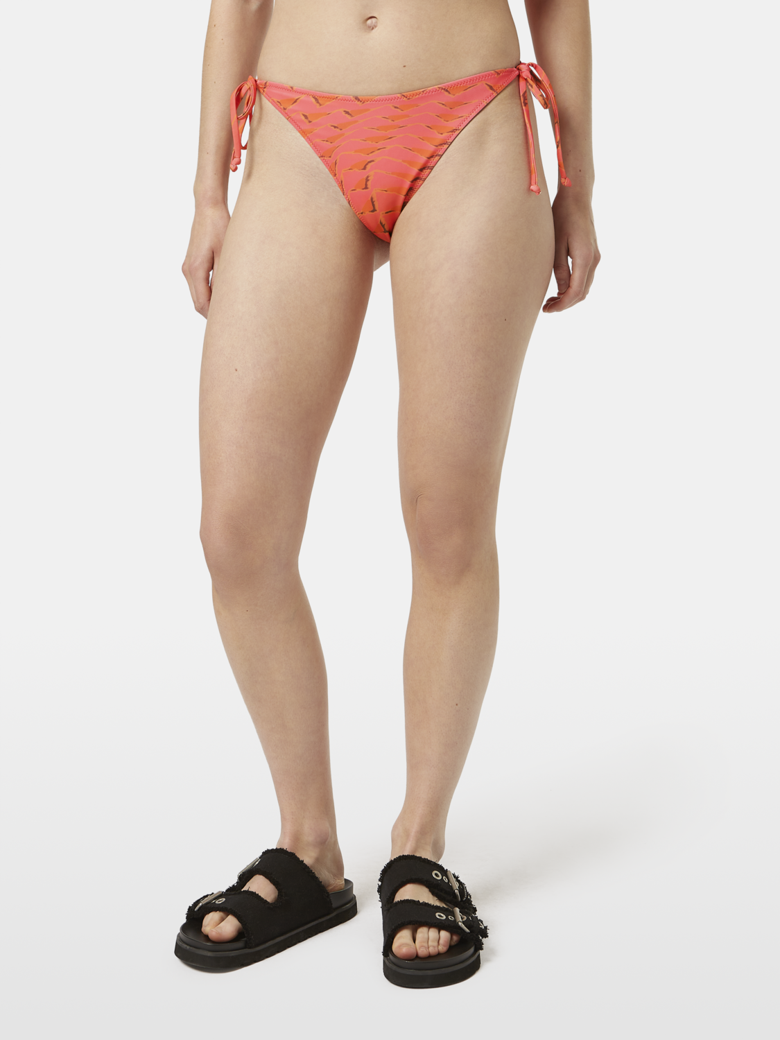 Printed bikini bottom from SCOTCH & SODA swimwear featuring colorful floral pattern and adjustable side ties.