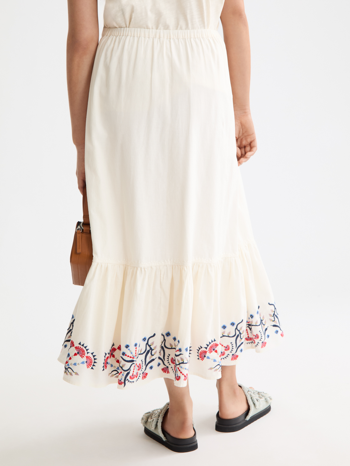 Embroidered maxi skirt by Scotch & Soda featuring intricate embroidery, flowing fabric, and a full-length design.