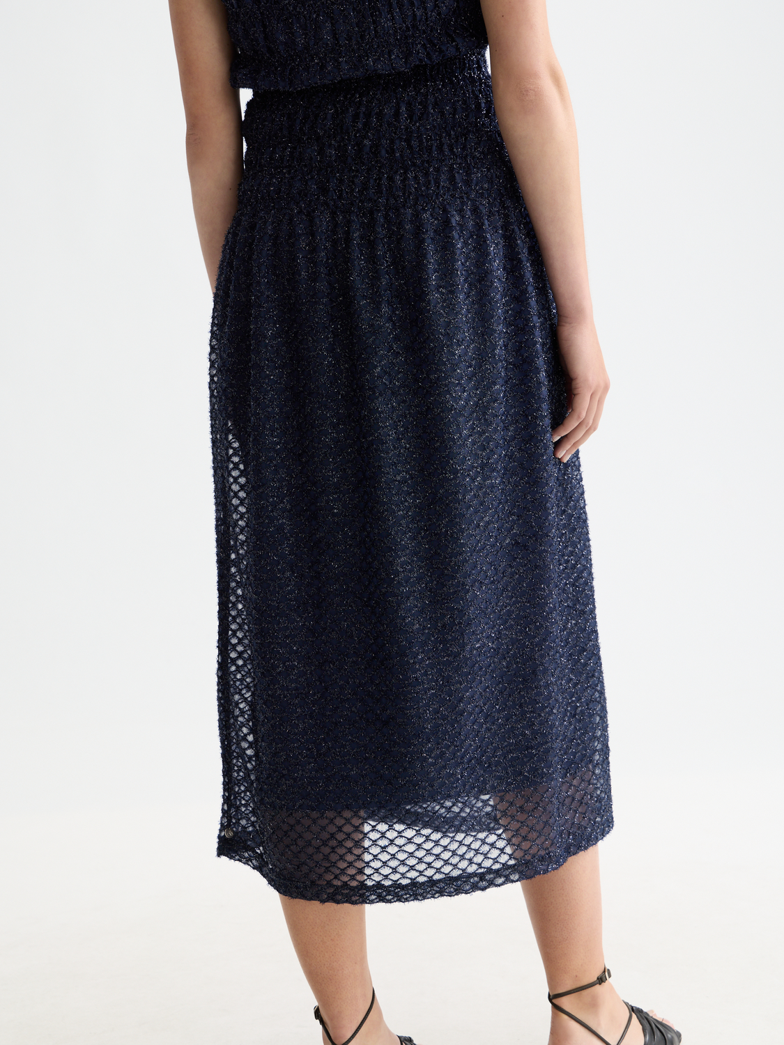 Lurex midi skirt from Scotch & Soda featuring metallic shimmer fabric and a flowy, stylish design.