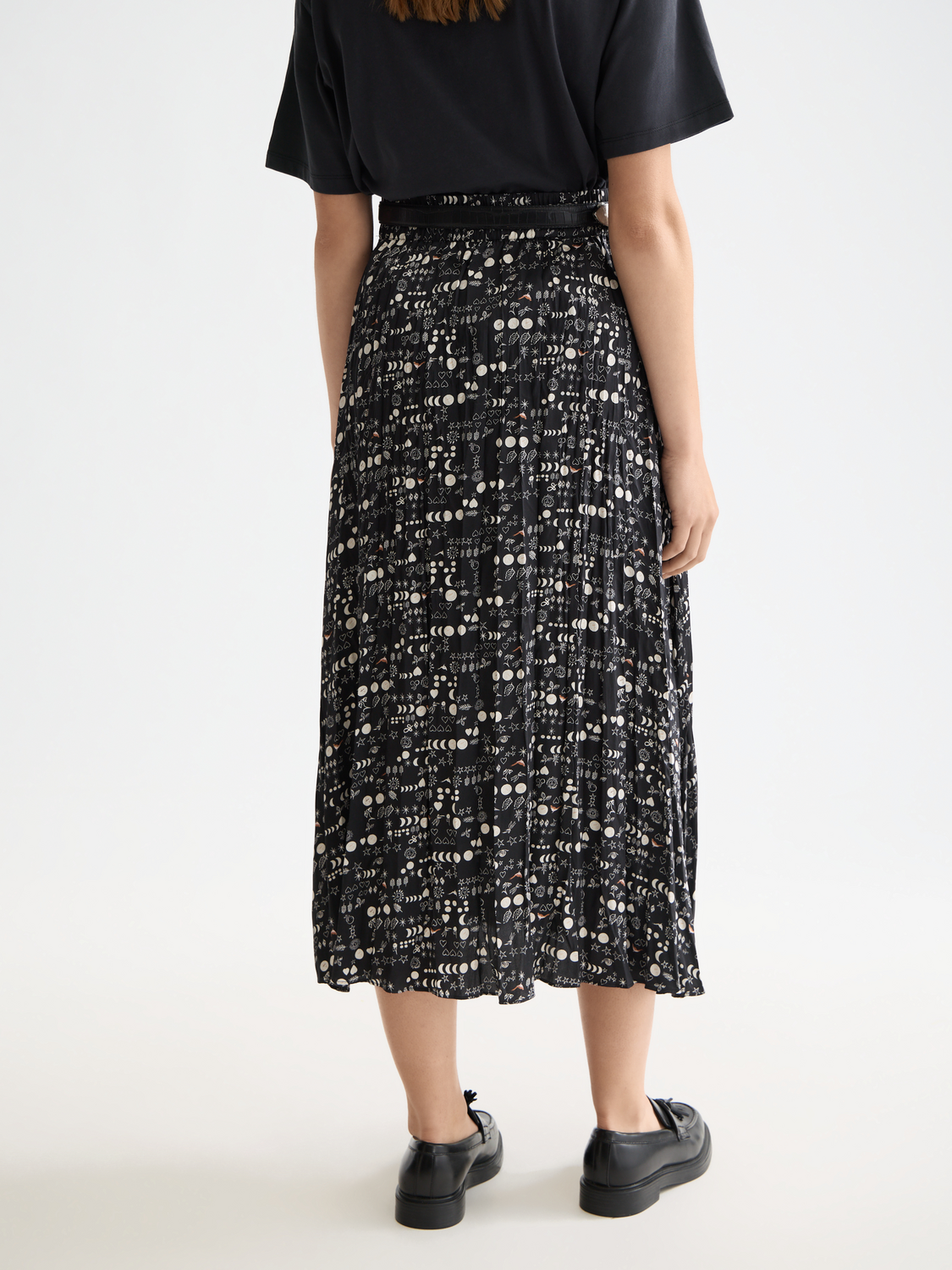 Crinkle pleated midi skirt by Scotch & Soda, shown from the back with a flowy, textured fabric and high waist design.