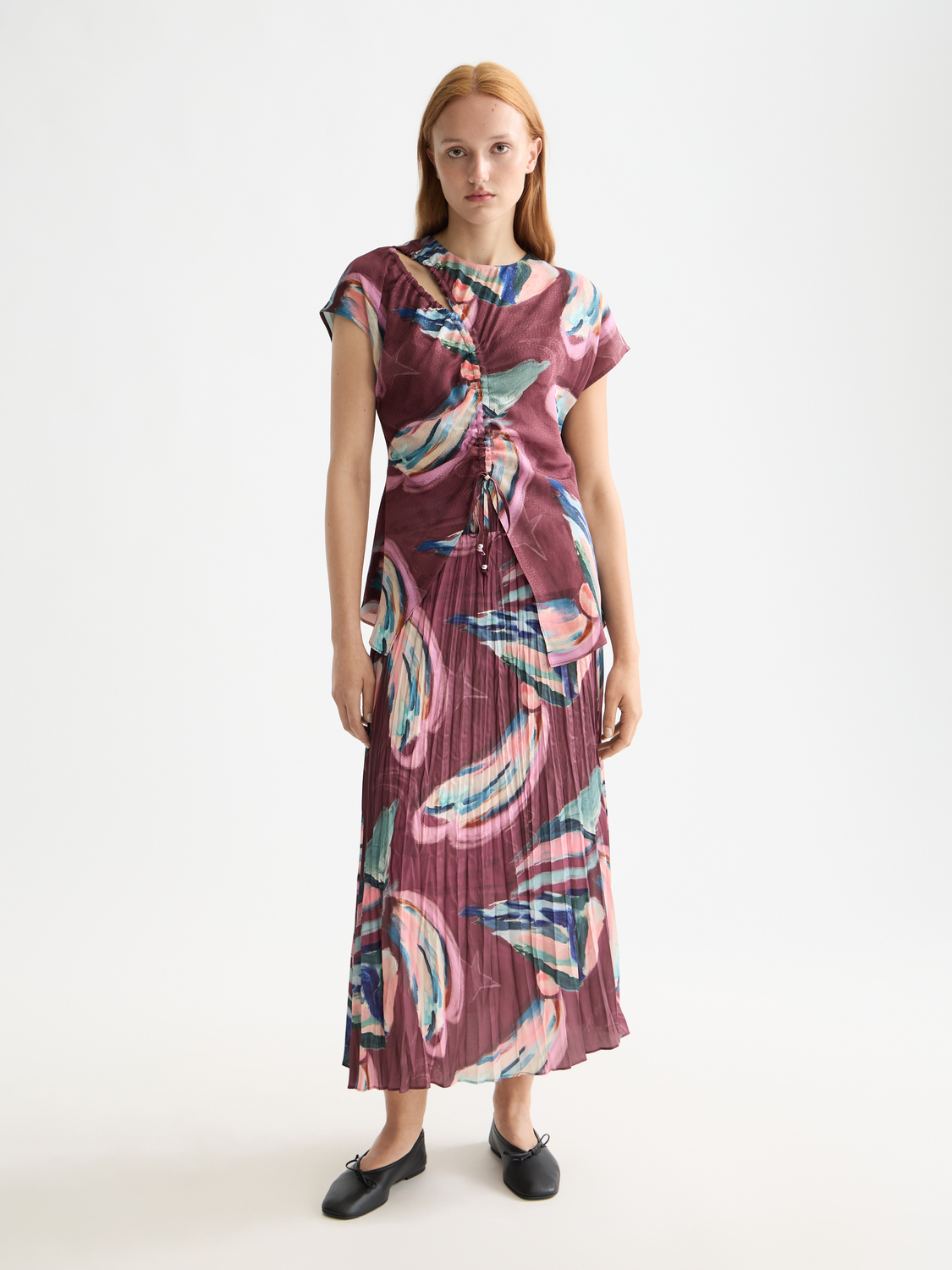 Crinkle pleated midi skirt by Scotch & Soda, showcasing its flowy fabric and stylish design in a neutral color.