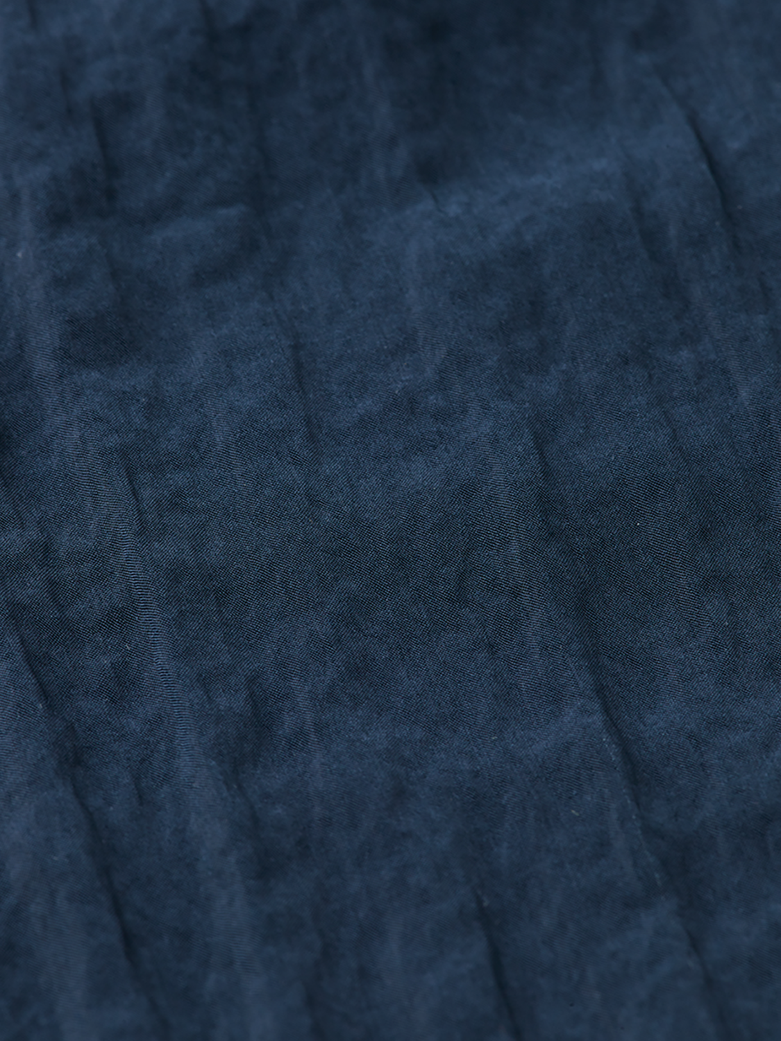 Scotch & Soda midi wrap skirt in patterned fabric, featuring a tie waist and flowy silhouette, displayed on a hanger.