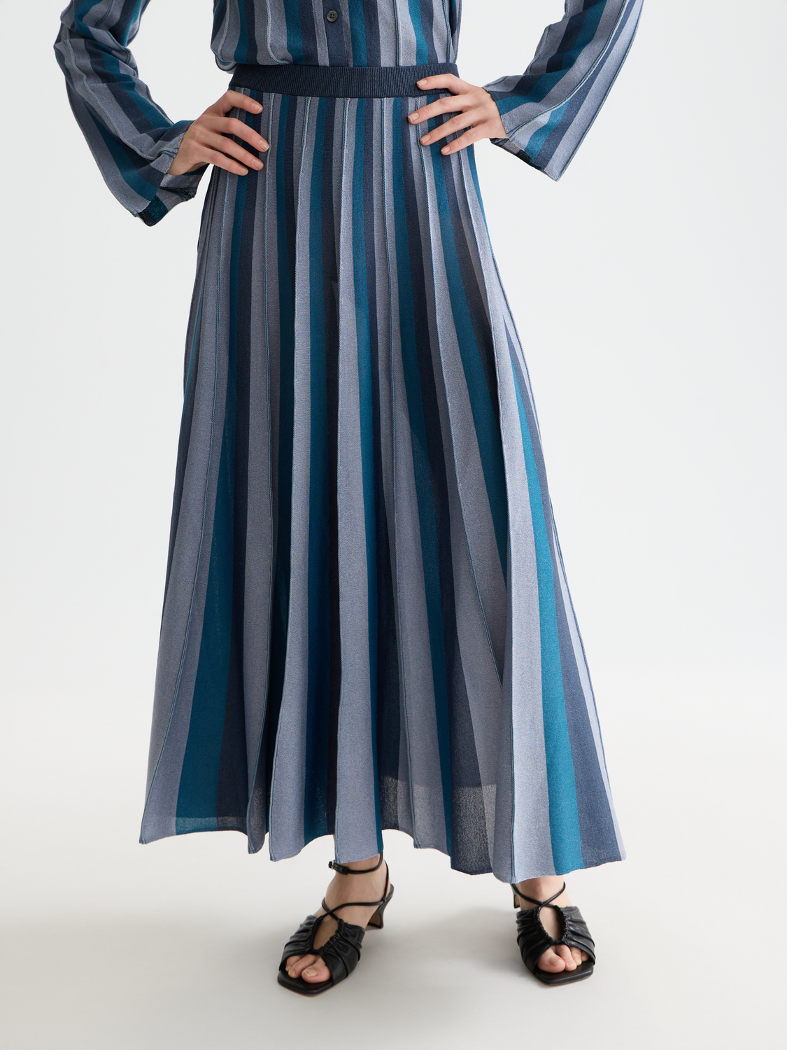 Pleated knit midi skirt by Scotch & Soda featuring a flowing design and soft fabric, shown in a front view.