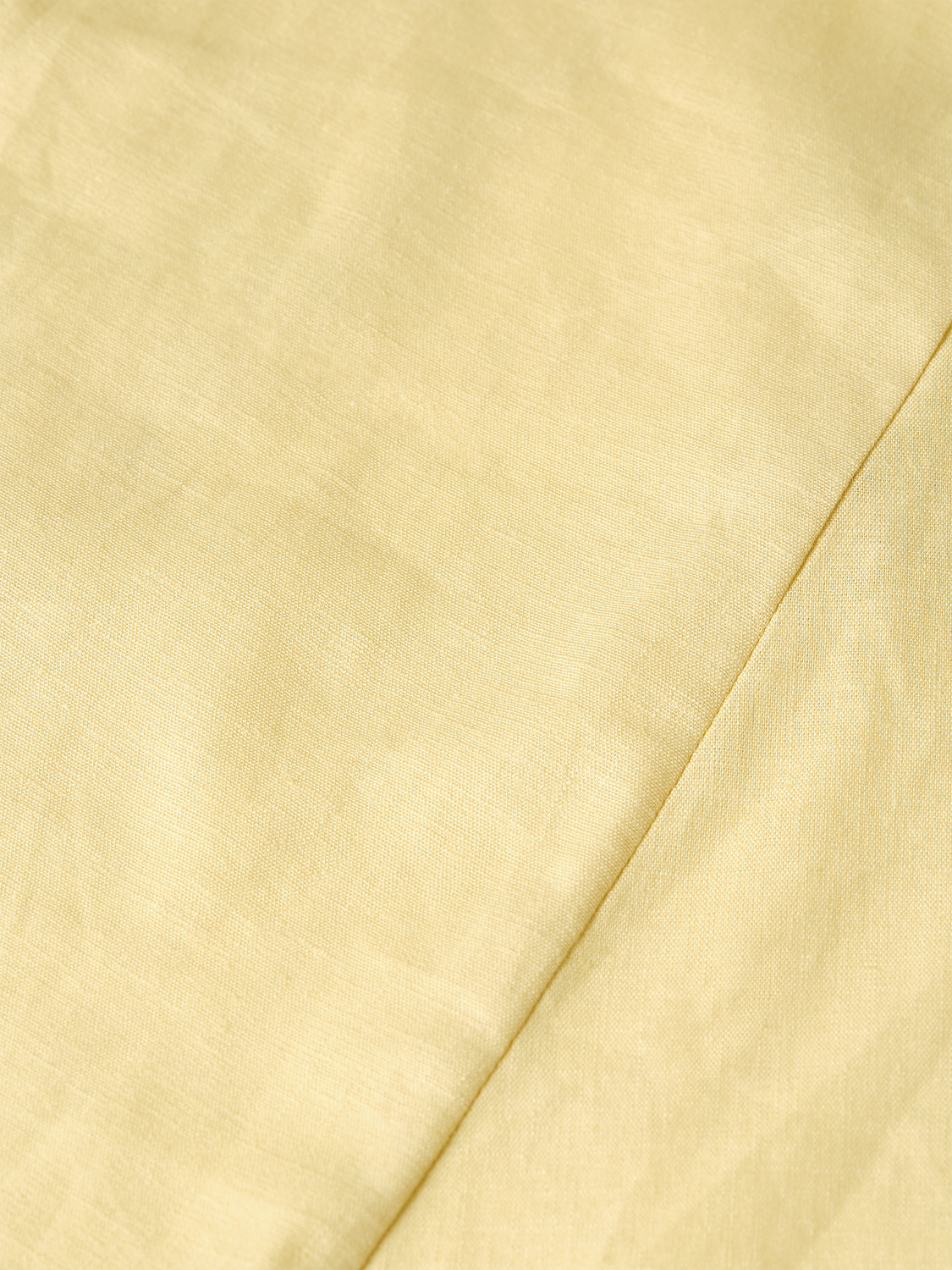 Linen wrap skirt by Scotch & Soda featuring a relaxed fit and natural beige color, displayed on a neutral background.