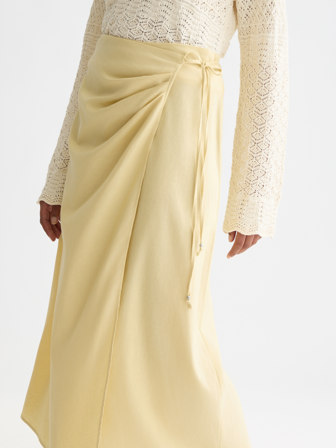 Linen wrap skirt by Scotch & Soda, featuring a stylish beige design with a tie waist and knee-length fit.