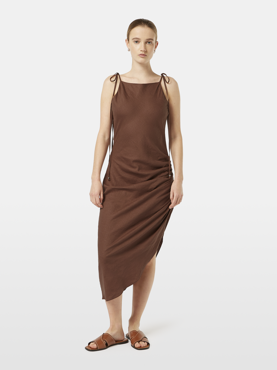 SCOTCH & SODA midi dress with floral pattern, featuring a fitted waist and flowing fabric, displayed on a hanger.