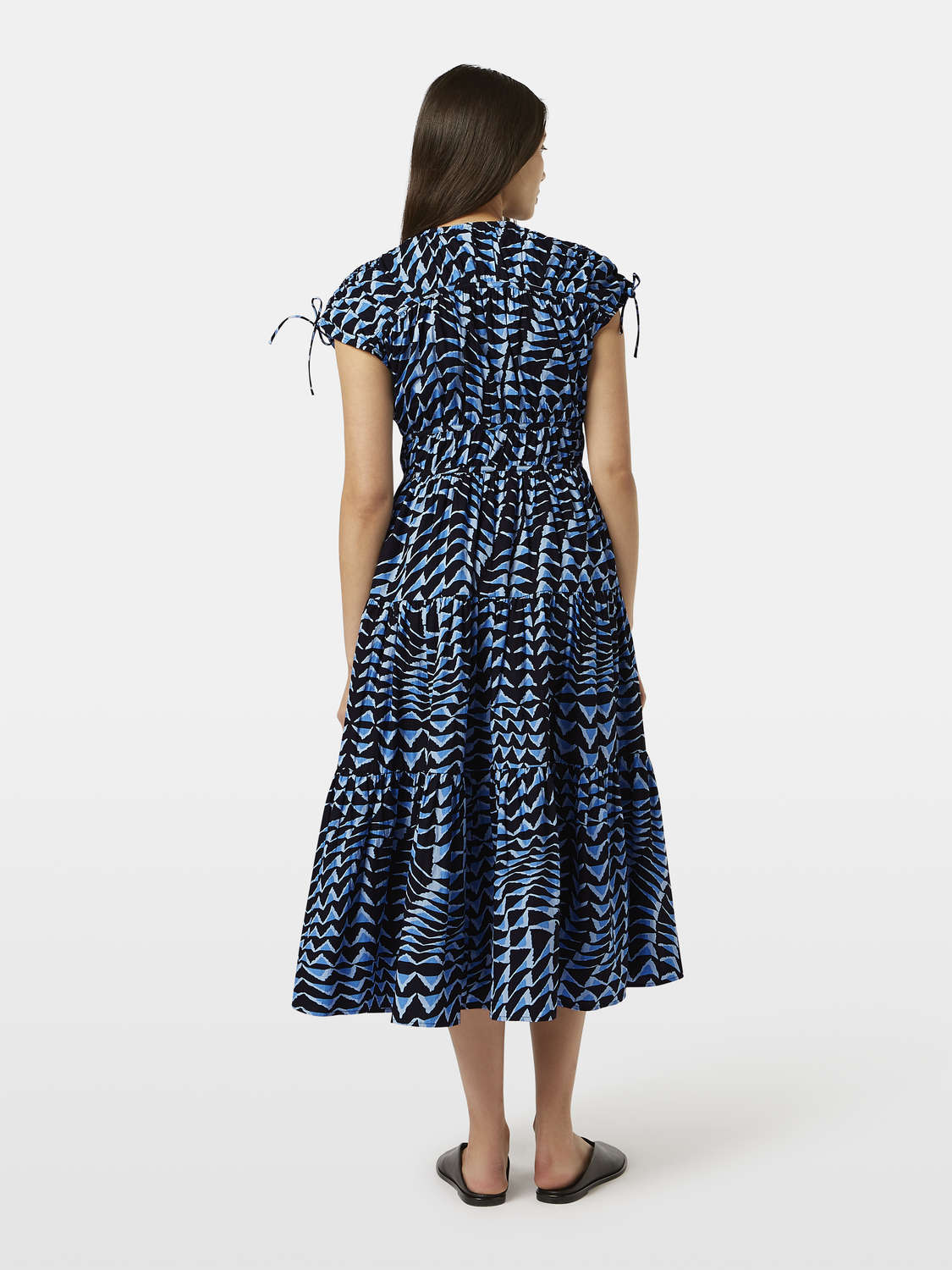 Black tiered poplin midi dress by Scotch & Soda, featuring a flowy design and feminine silhouette.