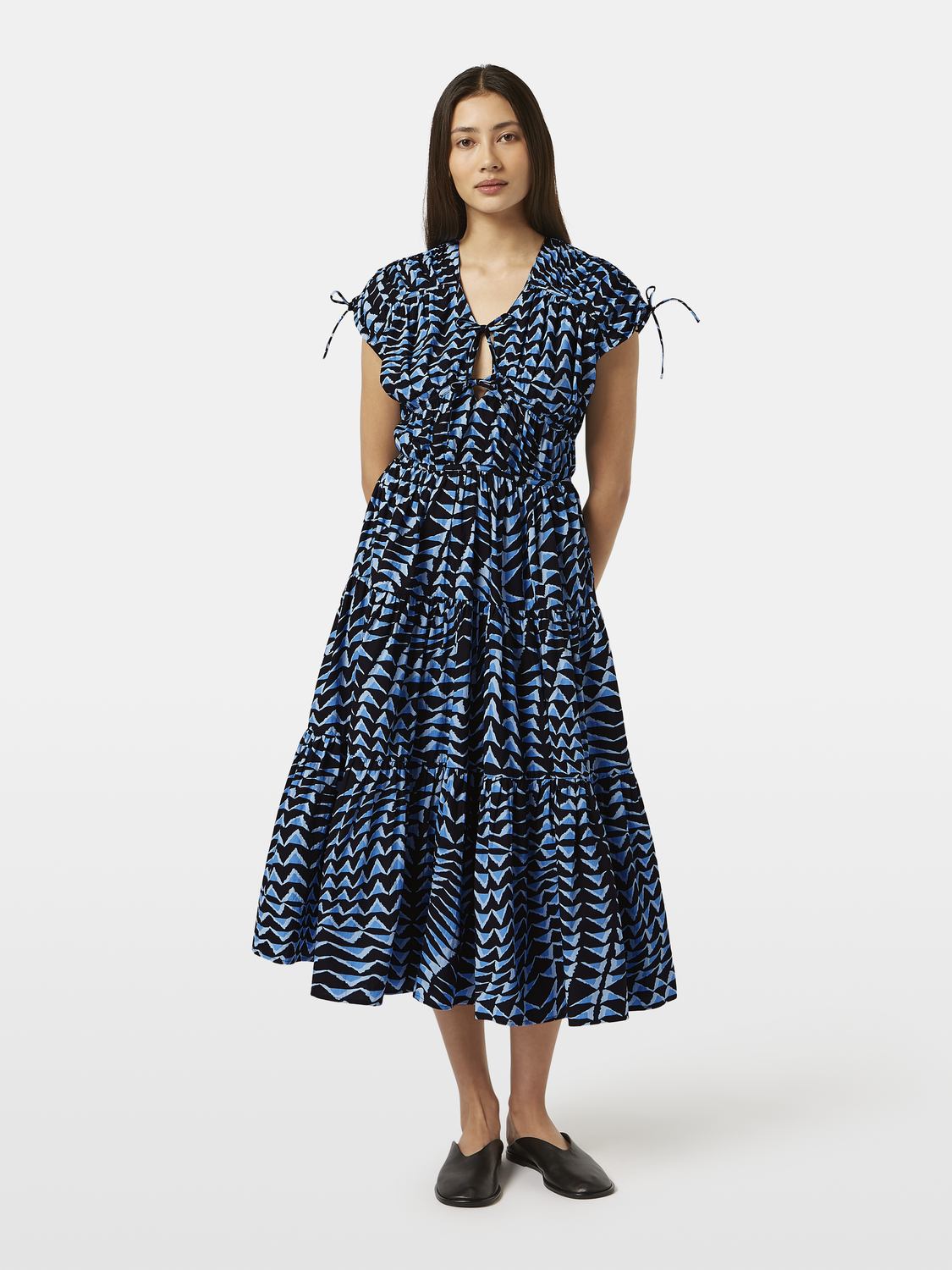 SCOTCH & SODA tiered poplin midi dress displayed on a hanger, featuring a sleeveless design and floral pattern.