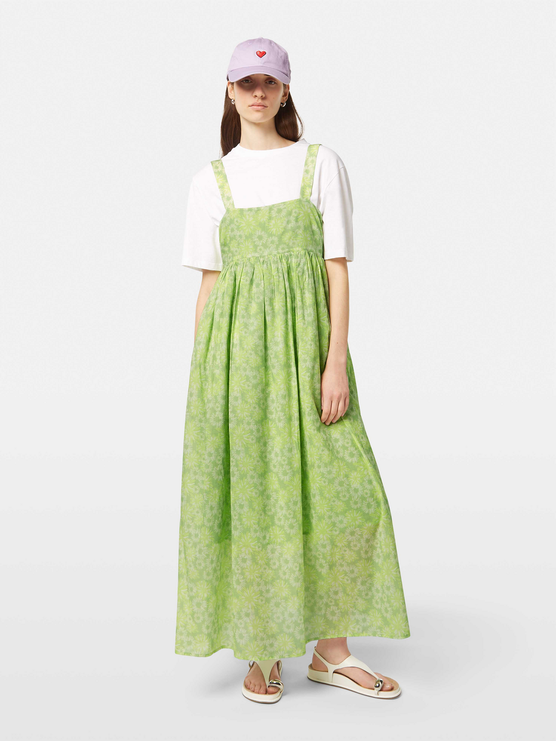 Scotch & Soda maxi dress with floral pattern, sleeveless design, and flowing fabric, displayed on a model.