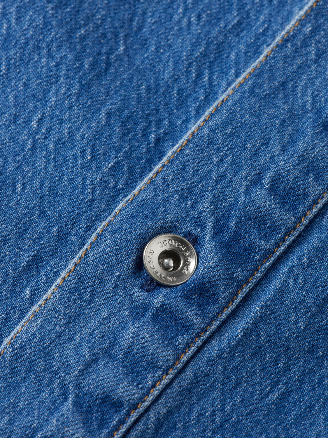 Washed denim mini shirtdress by Scotch & Soda featuring a classic collar, button front, and rolled sleeves on a casual dress.