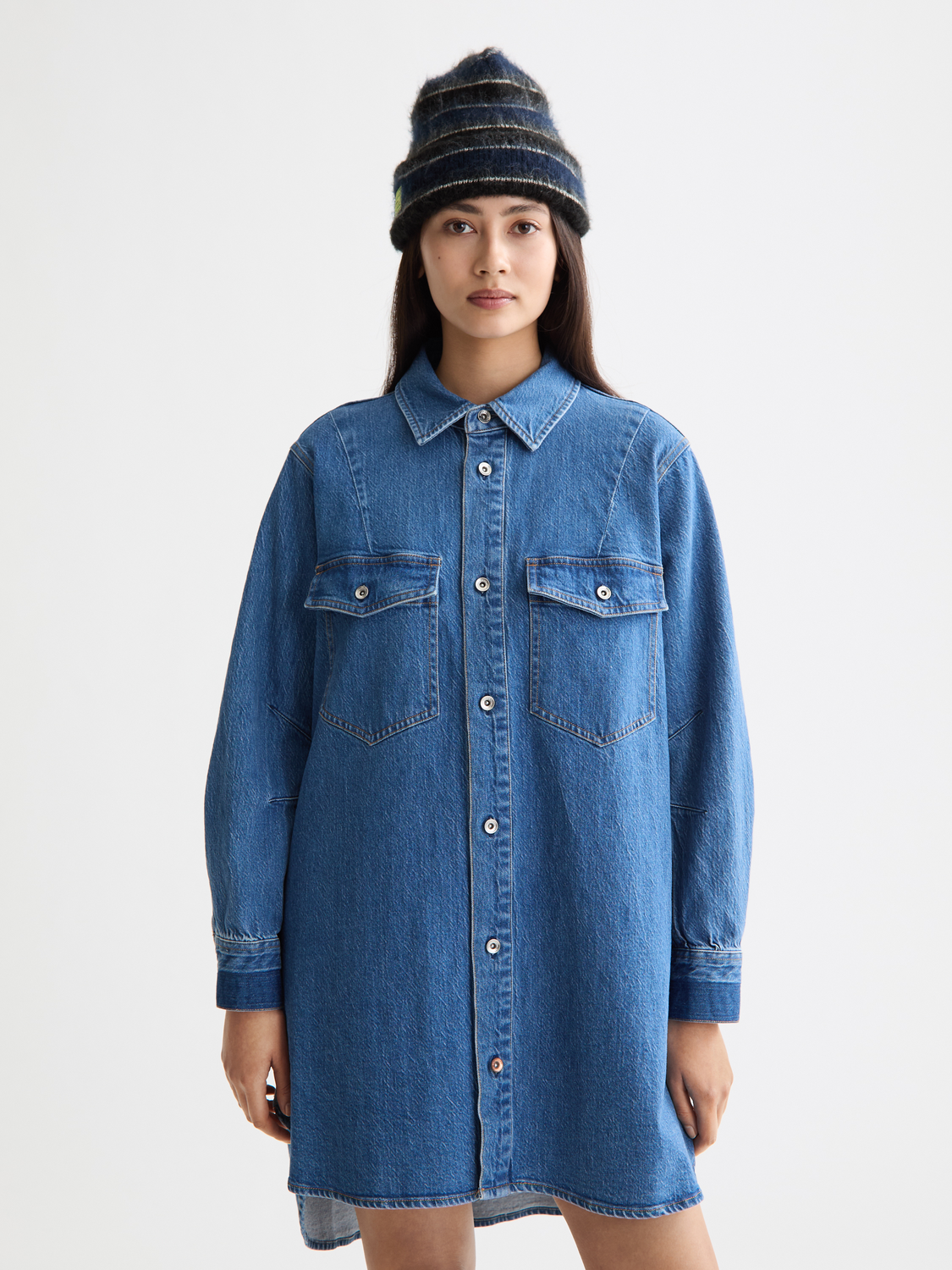 Washed denim mini shirtdress by Scotch & Soda, featuring a casual fit, button-down front, and short sleeves.