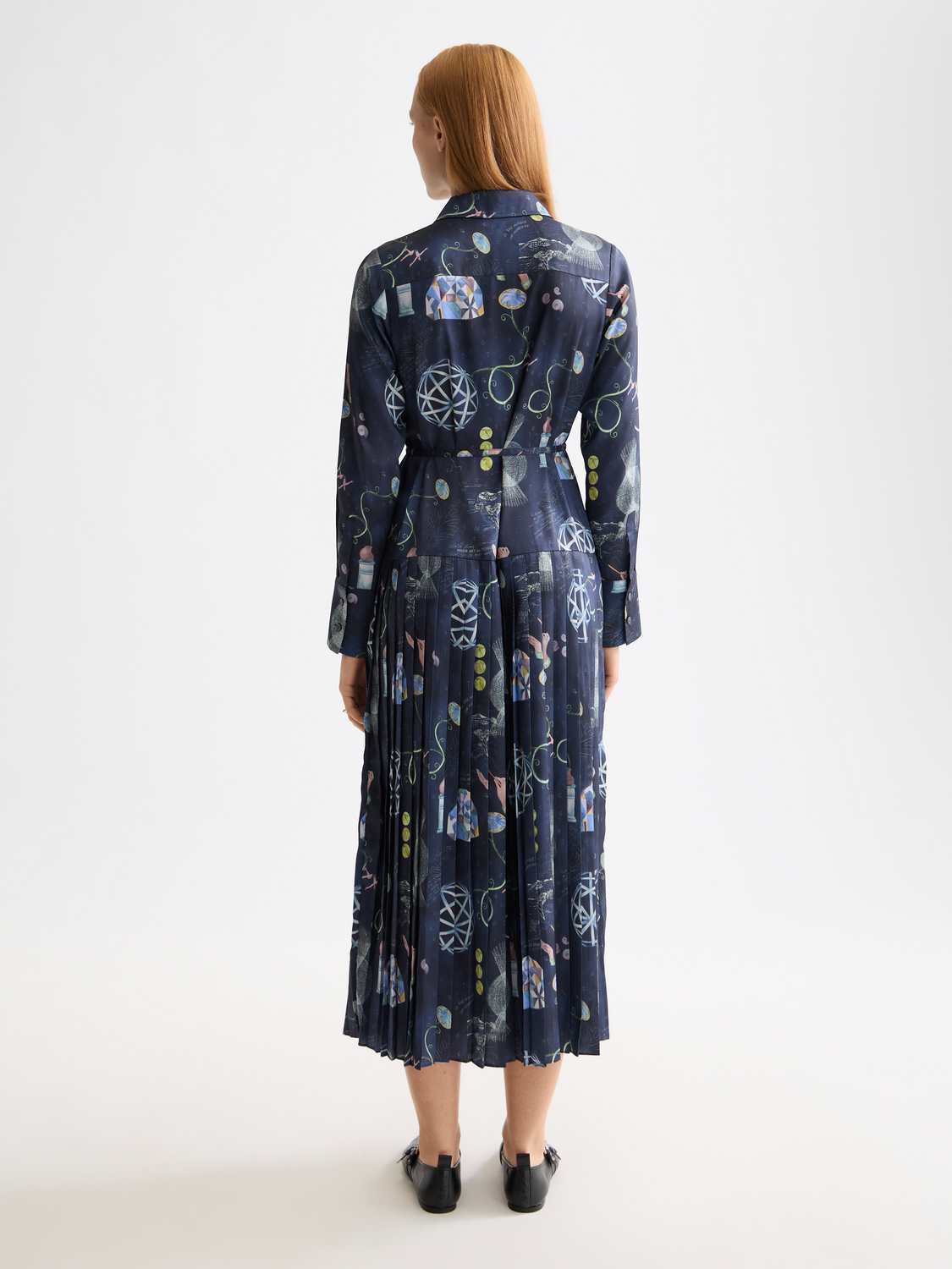 Black pleated midi dress by Scotch & Soda featuring a flowing silhouette and intricate pleat details.