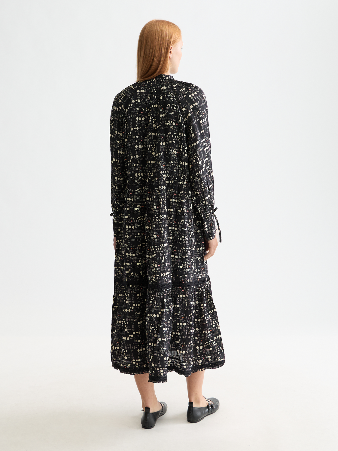Scarlet tiered maxi dress by Scotch & Soda featuring flowing fabric and layered design, worn by a model.