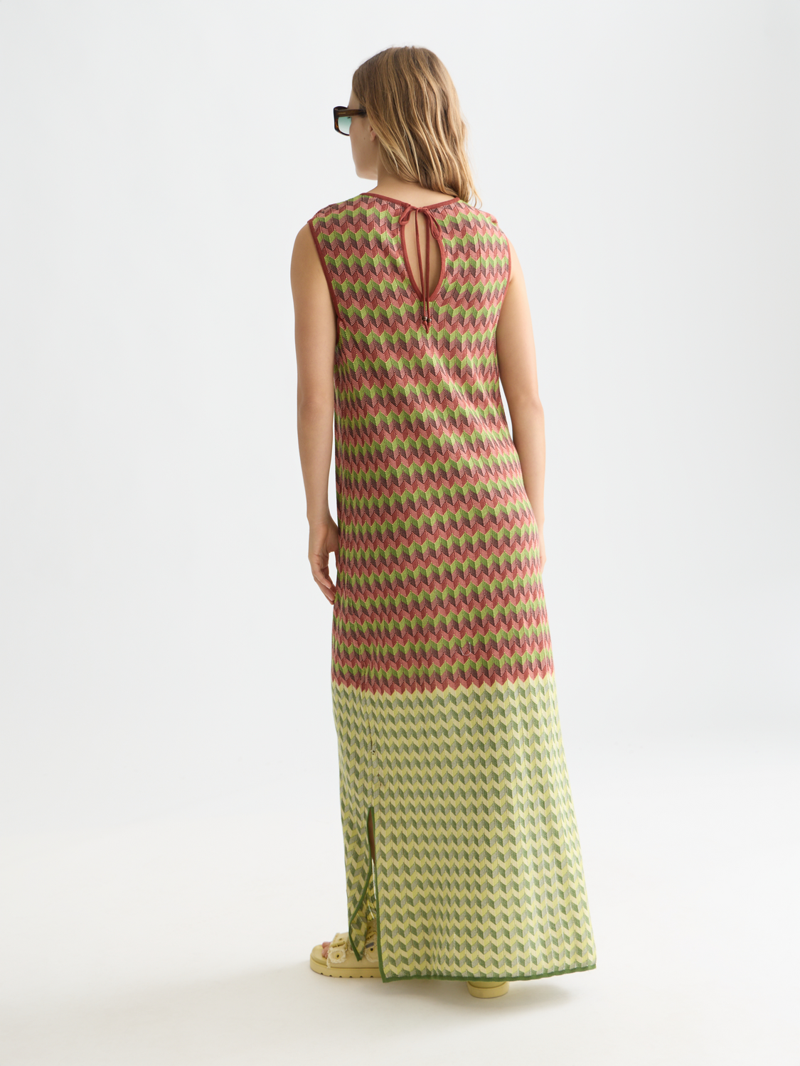 Knitted maxi dress by Scotch & Soda featuring a relaxed fit, long sleeves, and a textured knit fabric in a versatile color.