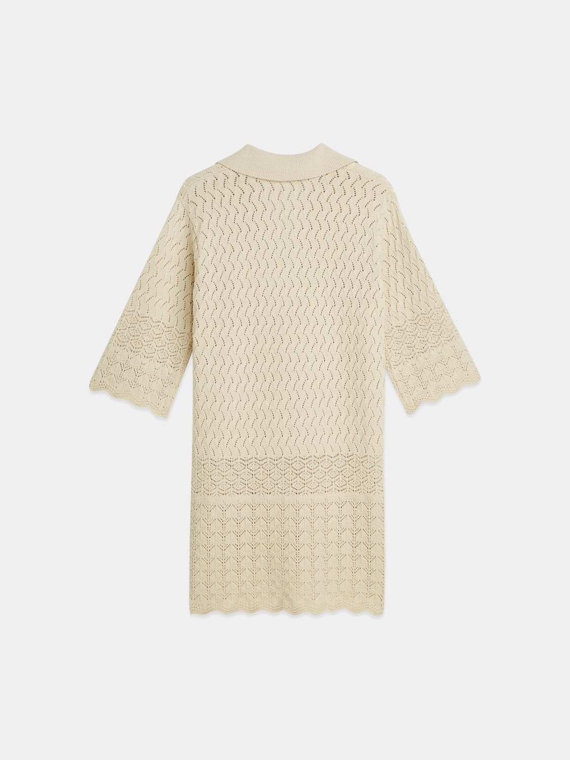 Black Pointelle knitted tunic dress by Scotch & Soda, featuring a textured, lightweight design and long sleeves.