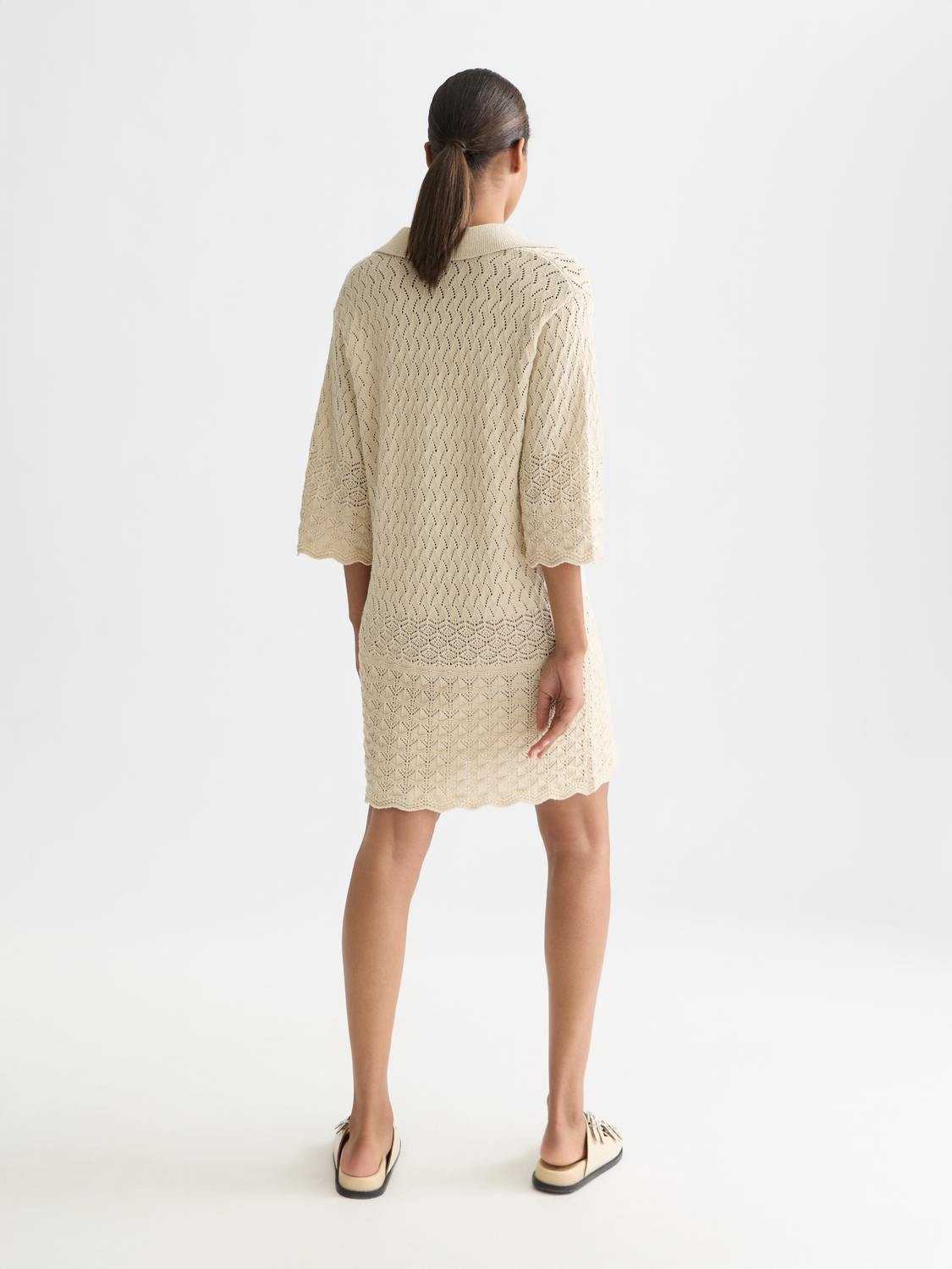 Pointelle knitted tunic dress by Scotch & Soda, featuring a textured pattern and relaxed fit, displayed on a mannequin.
